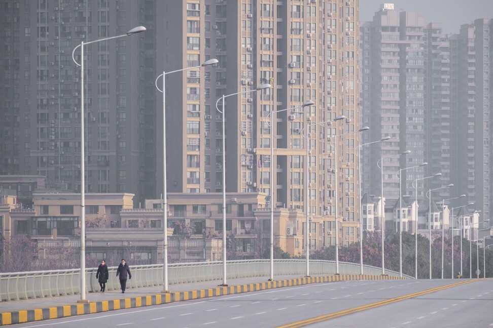 People walk down a deserted street in Wuhan, China, on January 28. Photo: AP