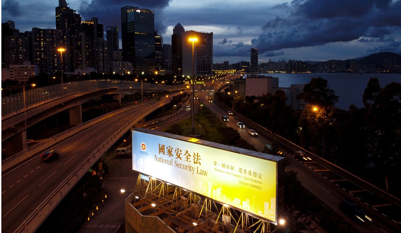 A large banner promoting Hong Kong’s new national security law stands near the freeway in Quarry Bay. Photo: Sun Yeung