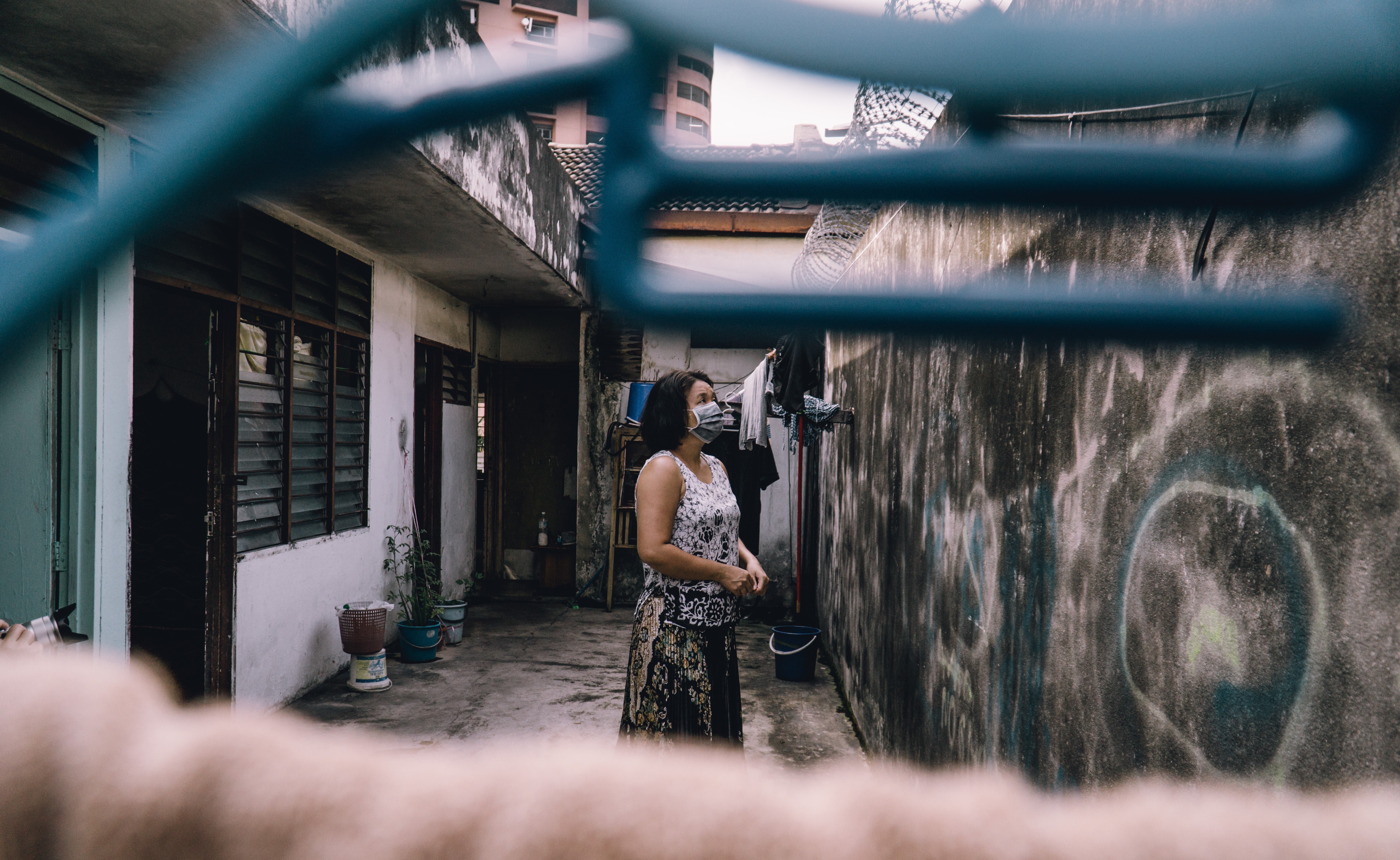 Sabe Phyu in the courtyard in Kuala Lumpur where she lives. Photo: Benjamin