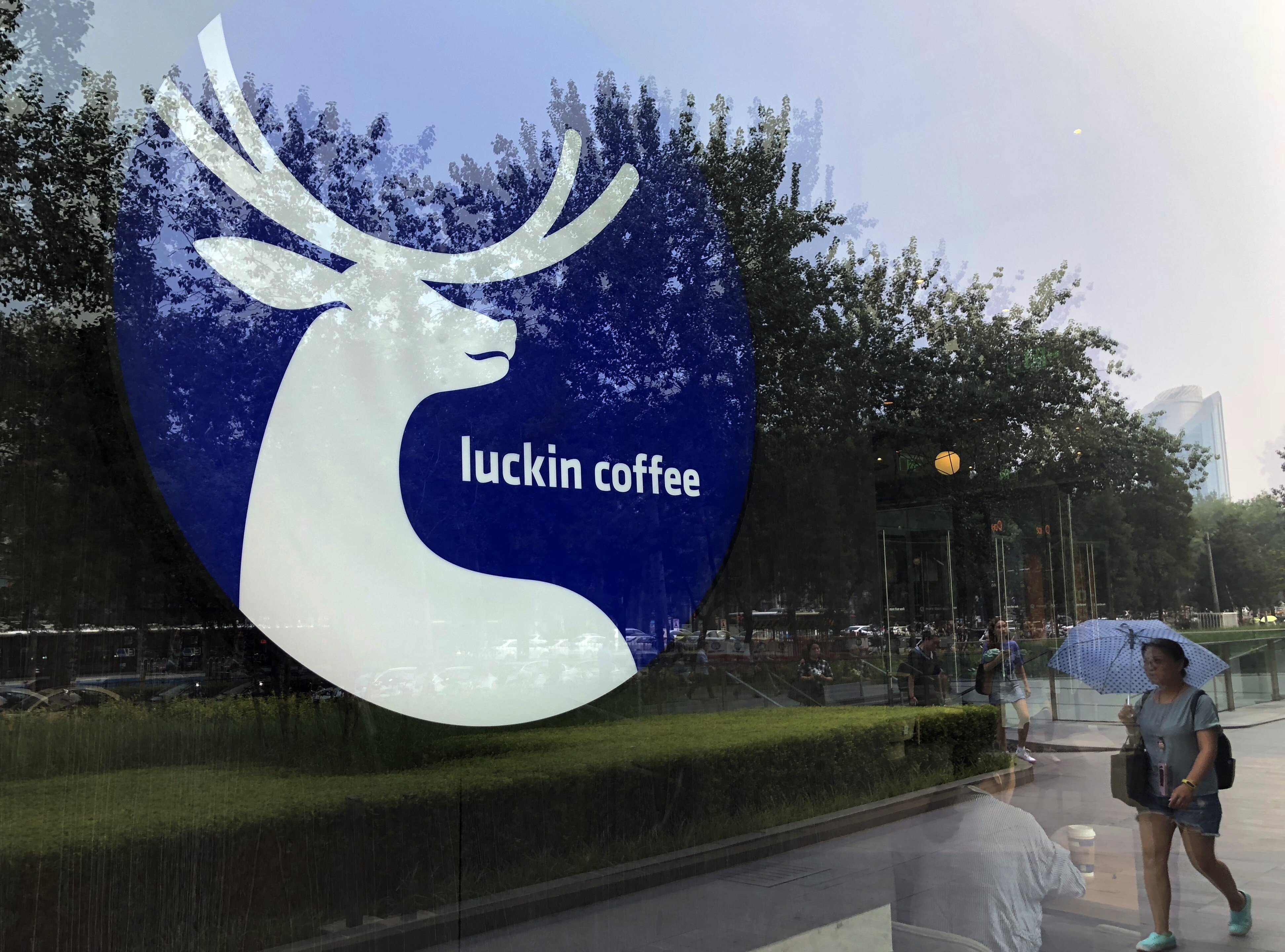 The logo of Luckin Coffee is seen on the window of a shop in Beijing. Luckin’s conceit was that it was going to have more stores in China than Starbucks – which it did – and that it was somehow going to transform coffee into a tech business, which it didn’t. Photo: Simon Song