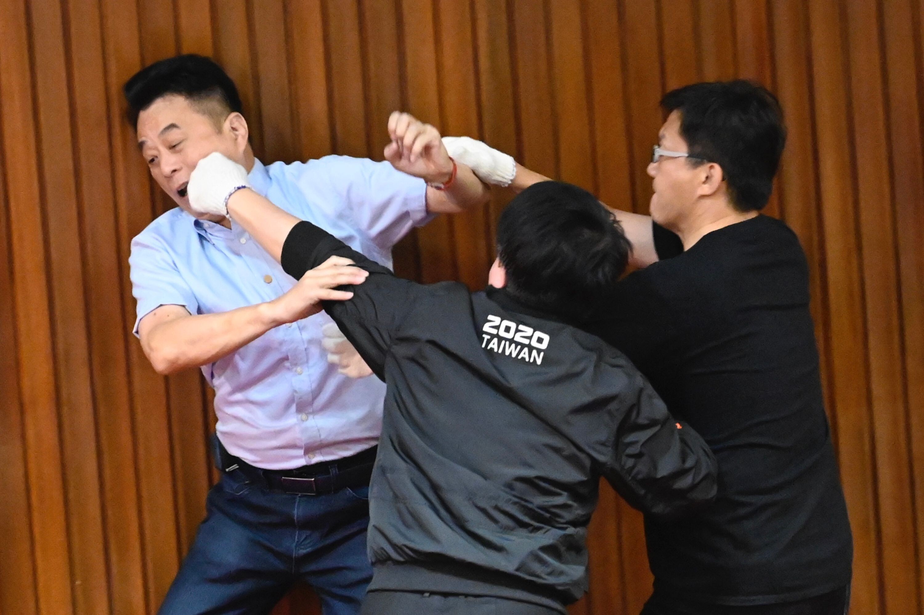 Scuffles break out during voting at Taiwan’s parliament on Friday between opposition and government lawmakers. Photo: AFP