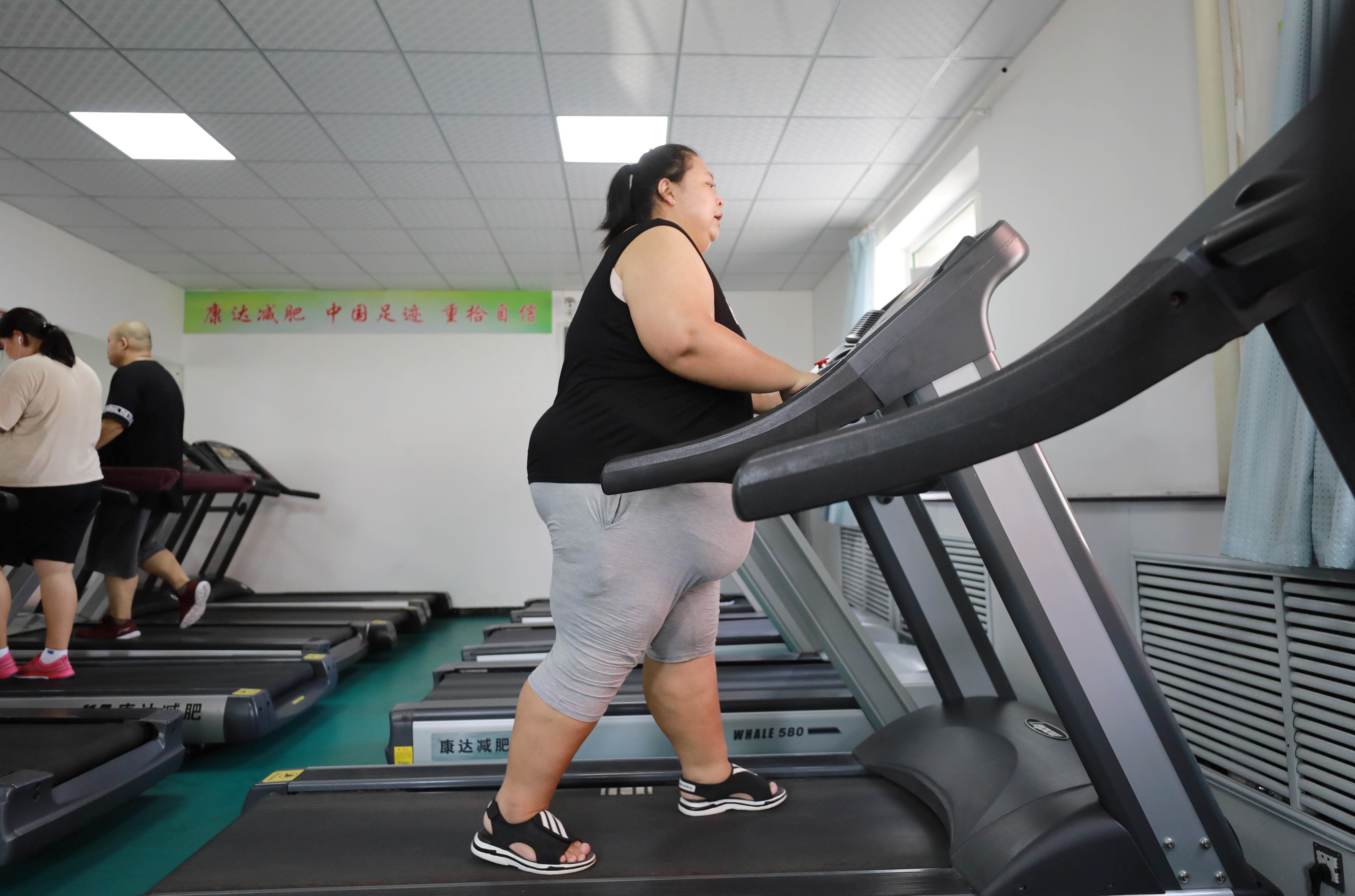 An overweight woman exercises at a weight loss clinic in Changchun, Jilin province, China. A new study has revealed that cholesterol levels are on the rise in Asia, but a healthy diet and exercise can still combat it. Photo: AFP