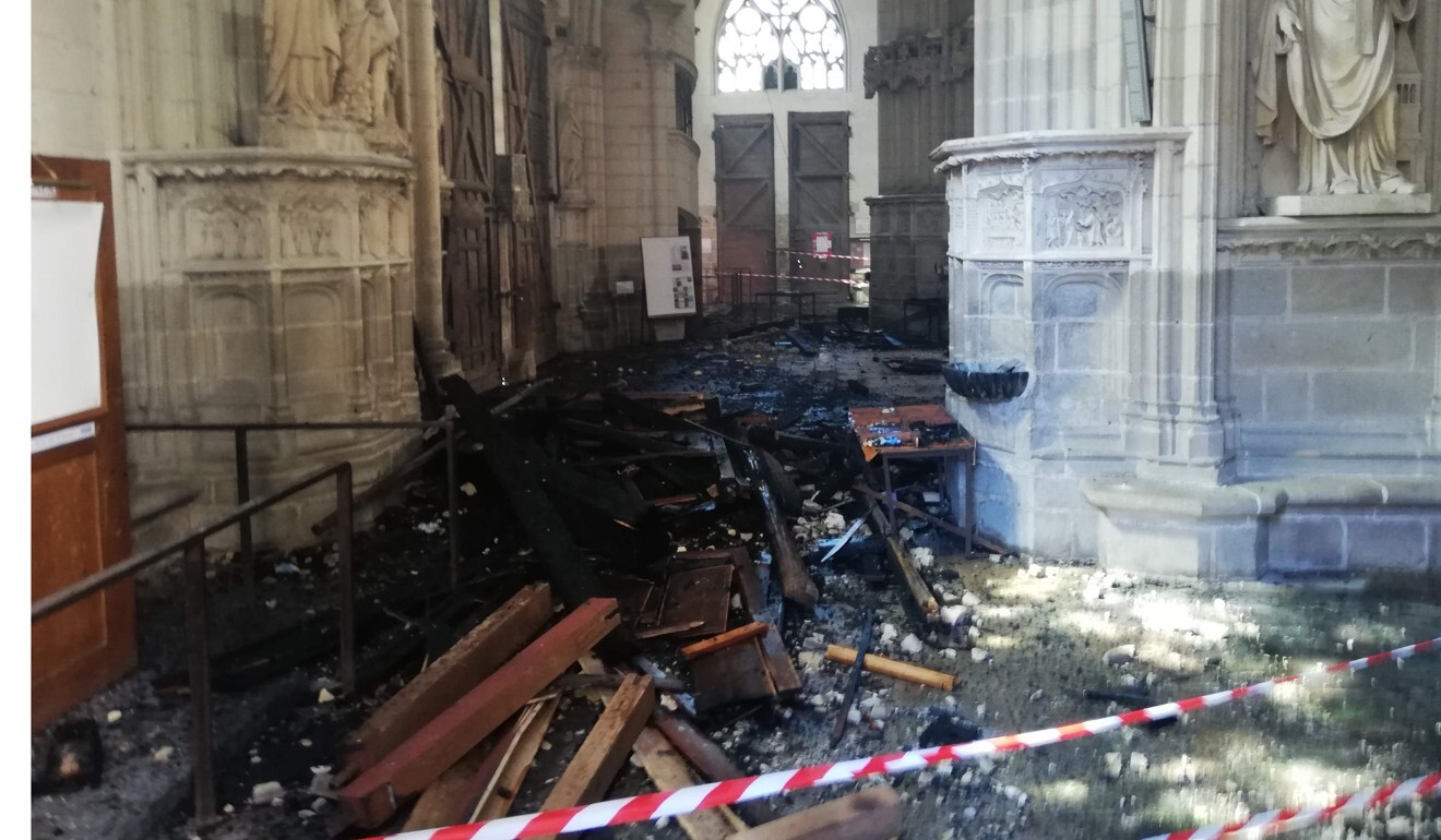 The remains of the burnt organ after it fell from the 1st floor during a fire inside the Saint-Pierre-et-Saint-Paul cathedral in Nantes, western France. Photo: AFP