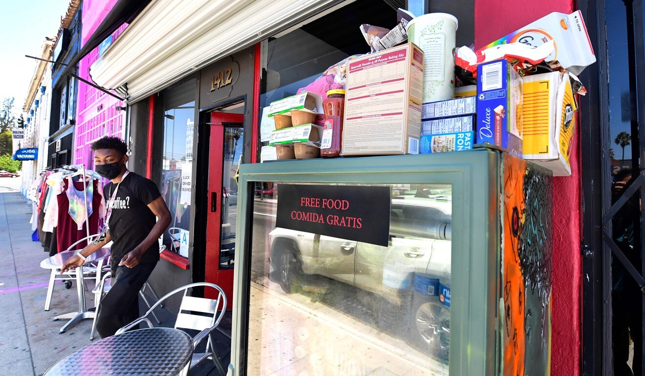 A staff member steps out of the Little Amsterdam cafe in Los Angeles to restock the frosted-glass fridge. Photo: AFP