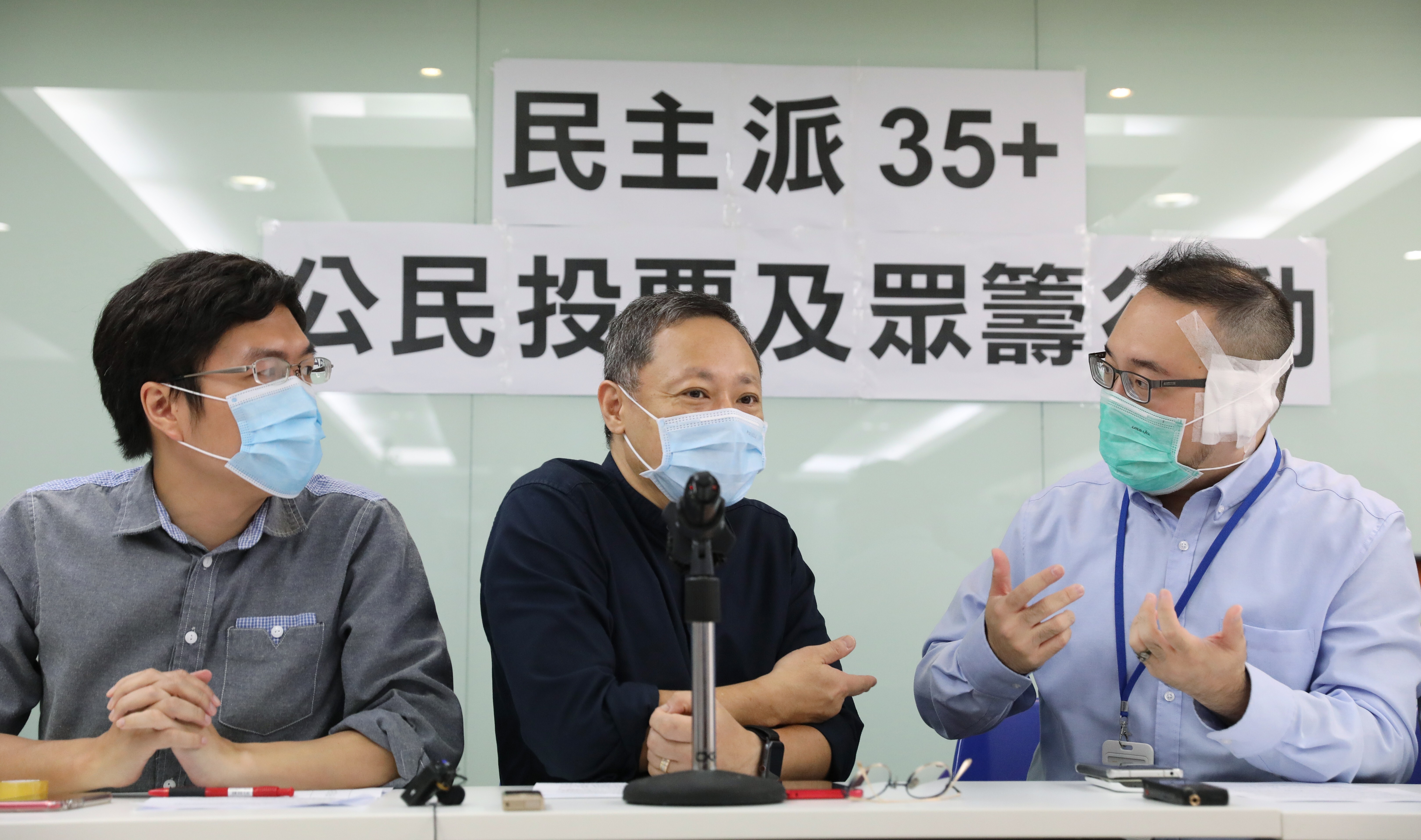 Pro-democracy camp members (from left) Au Nok-hin, Benny Tai and Andrew Chiu Ka-yin hold a press conference in Mong Kok on June 9, calling on the public to participate in the opposition campaign for “35-plus” seats in the Legislative Council. What the camp intends to do with a majority should it get one remains unclear. Photo: Nora Tam