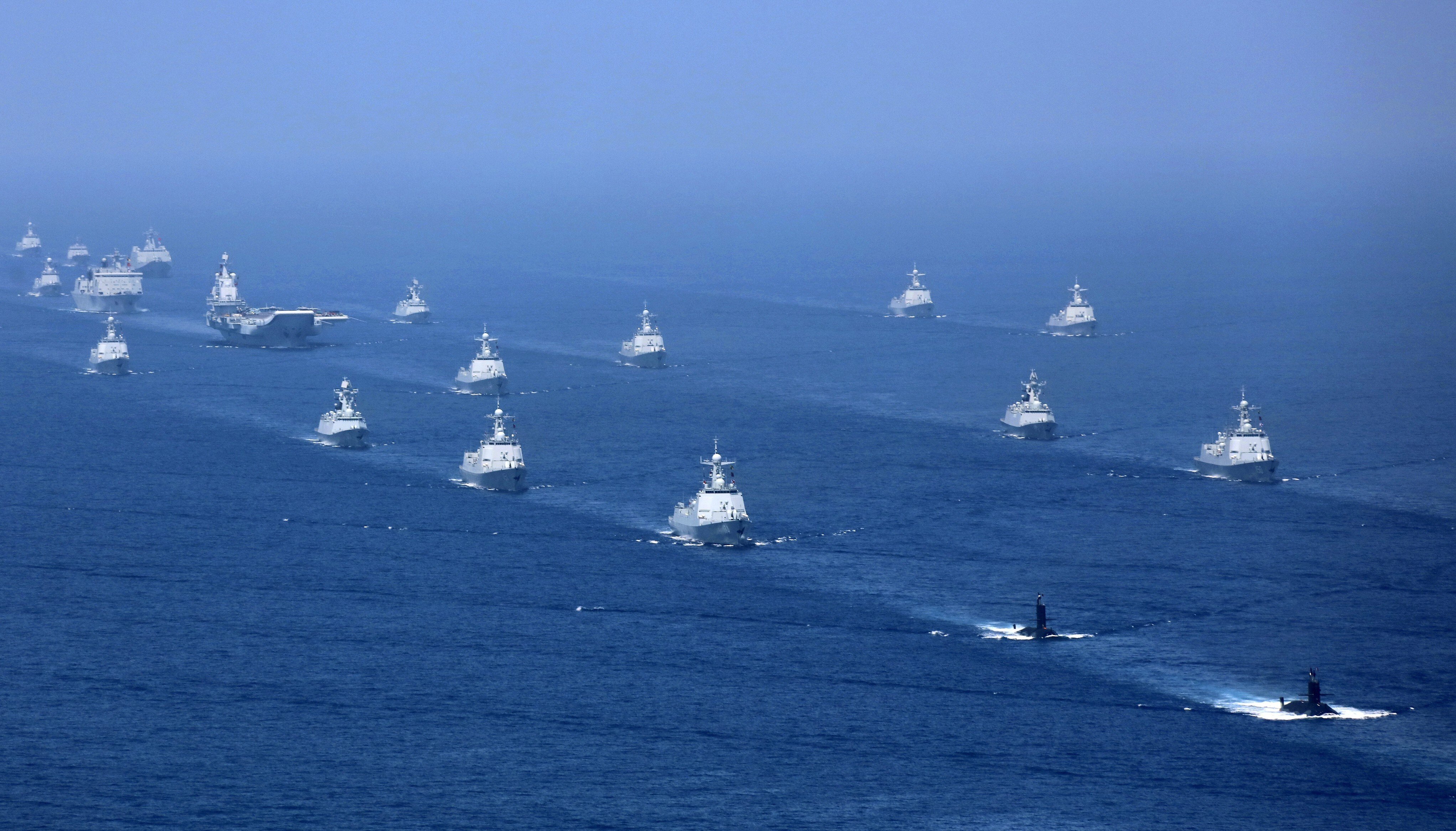 China’s Liaoning aircraft carrier is accompanied by navy frigates and submarines during exercises in the South China Sea. Photo: AP