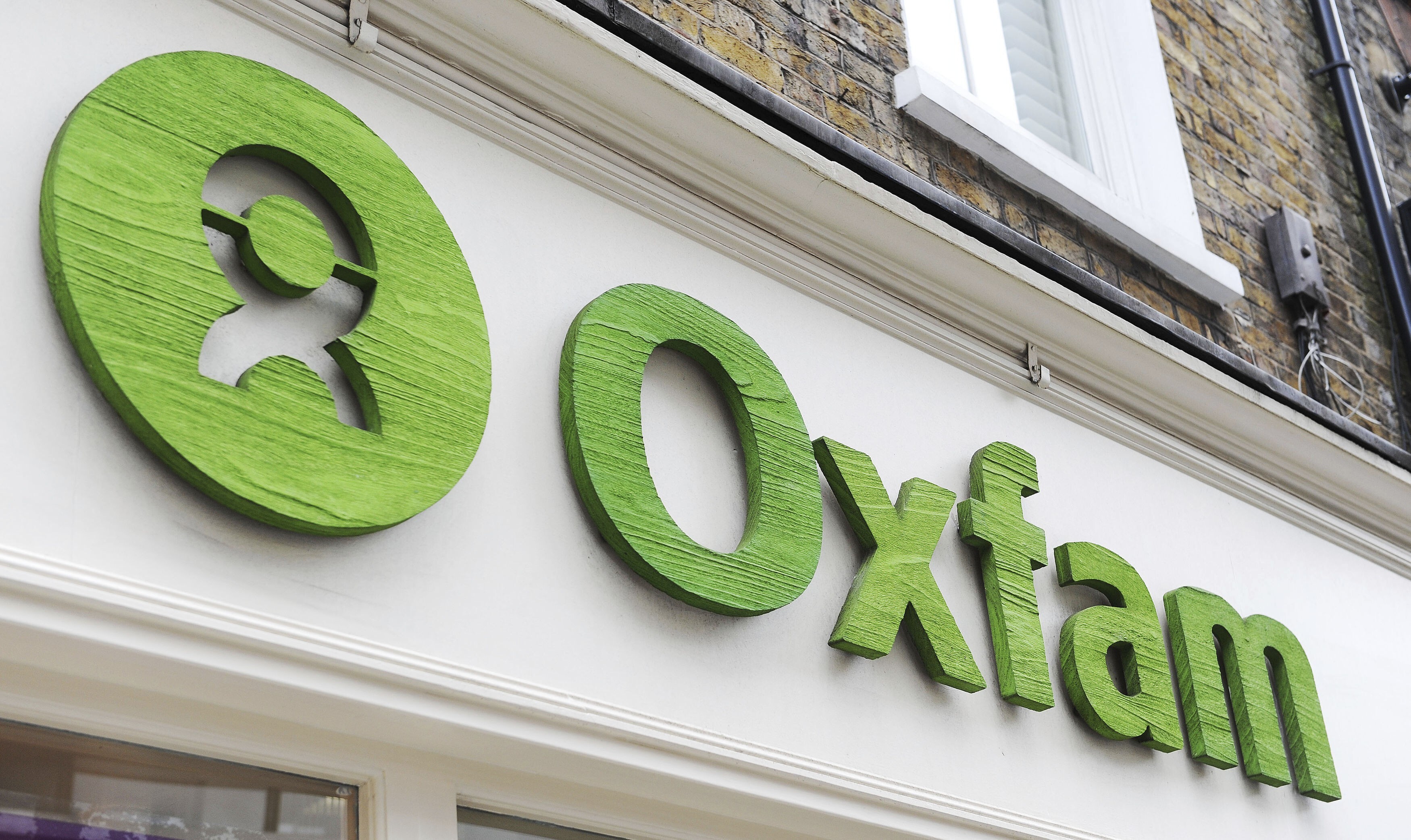 Oxfam, which entered Hong Kong in 1976, now operates in more than 60 countries to fight poverty. Photo: PA via AP