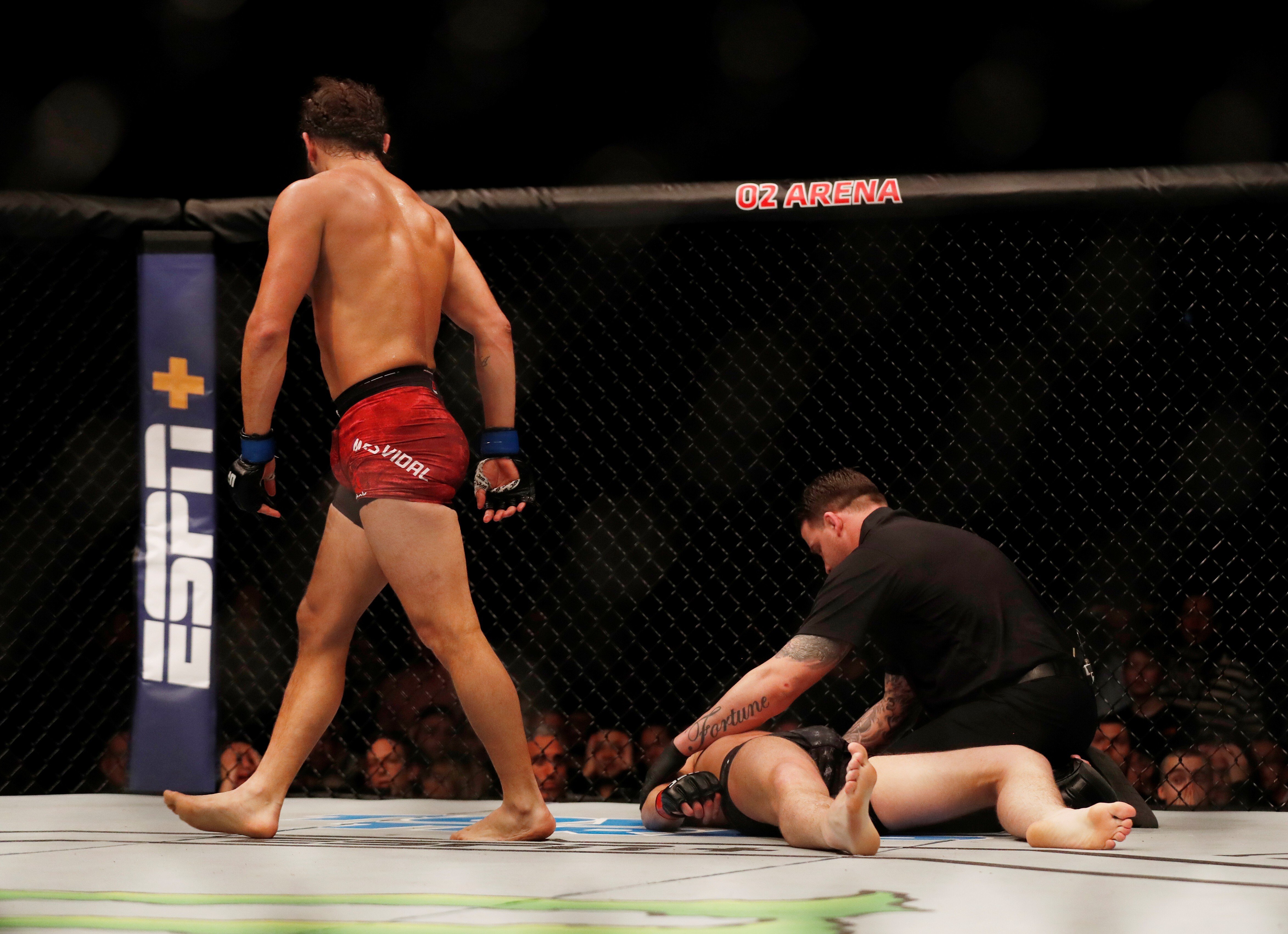 Darren Till receives medical attention after being knocked out by Jorge Masvidal. Photo: Reuters