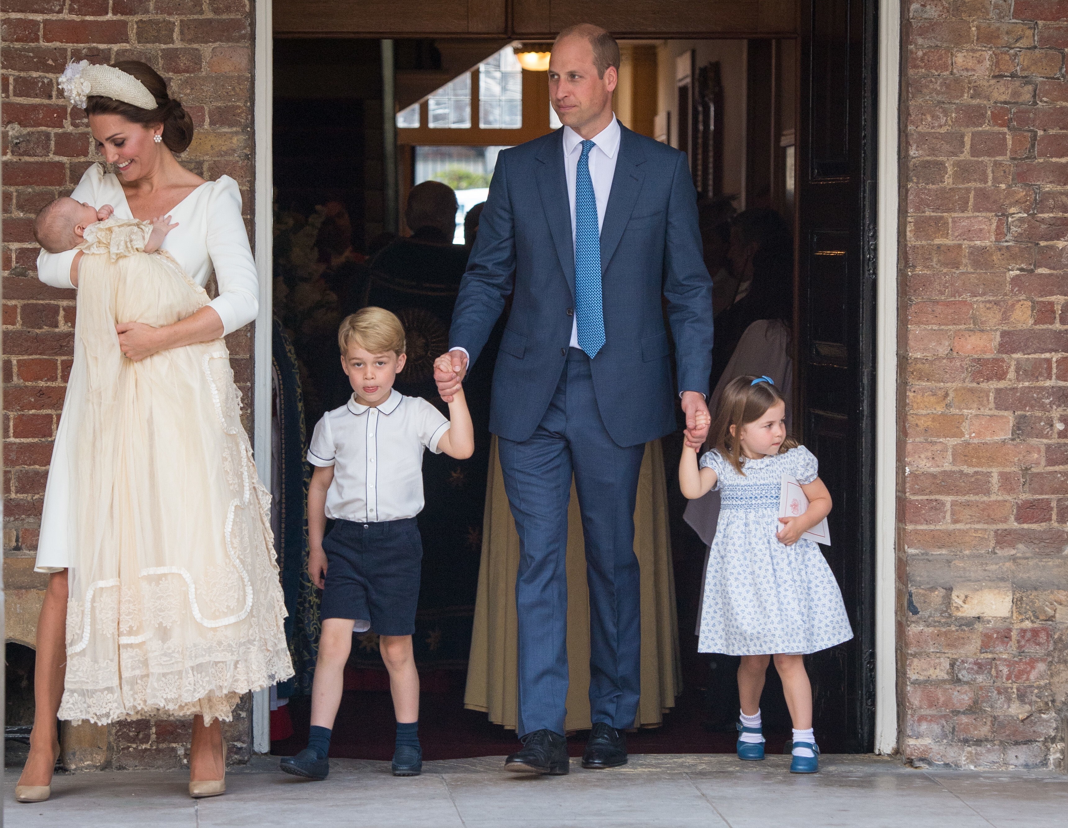 Catherine (left), the Duchess of Cambridge, holds Prince Louis as she and her family – husband Prince William (second right) and their children Prince George and Princess Charlotte – attend the christening of Prince Louis at St. James’s Palace in London. Photo: EPA-EFE