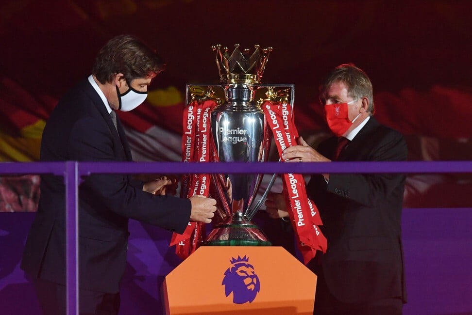 Premier League CEO Richard Masters and Liverpool legend Kenny Dalglish prepare the Premier League trophy for presentation, but Masters may have bigger concerns. Photo: Reuters