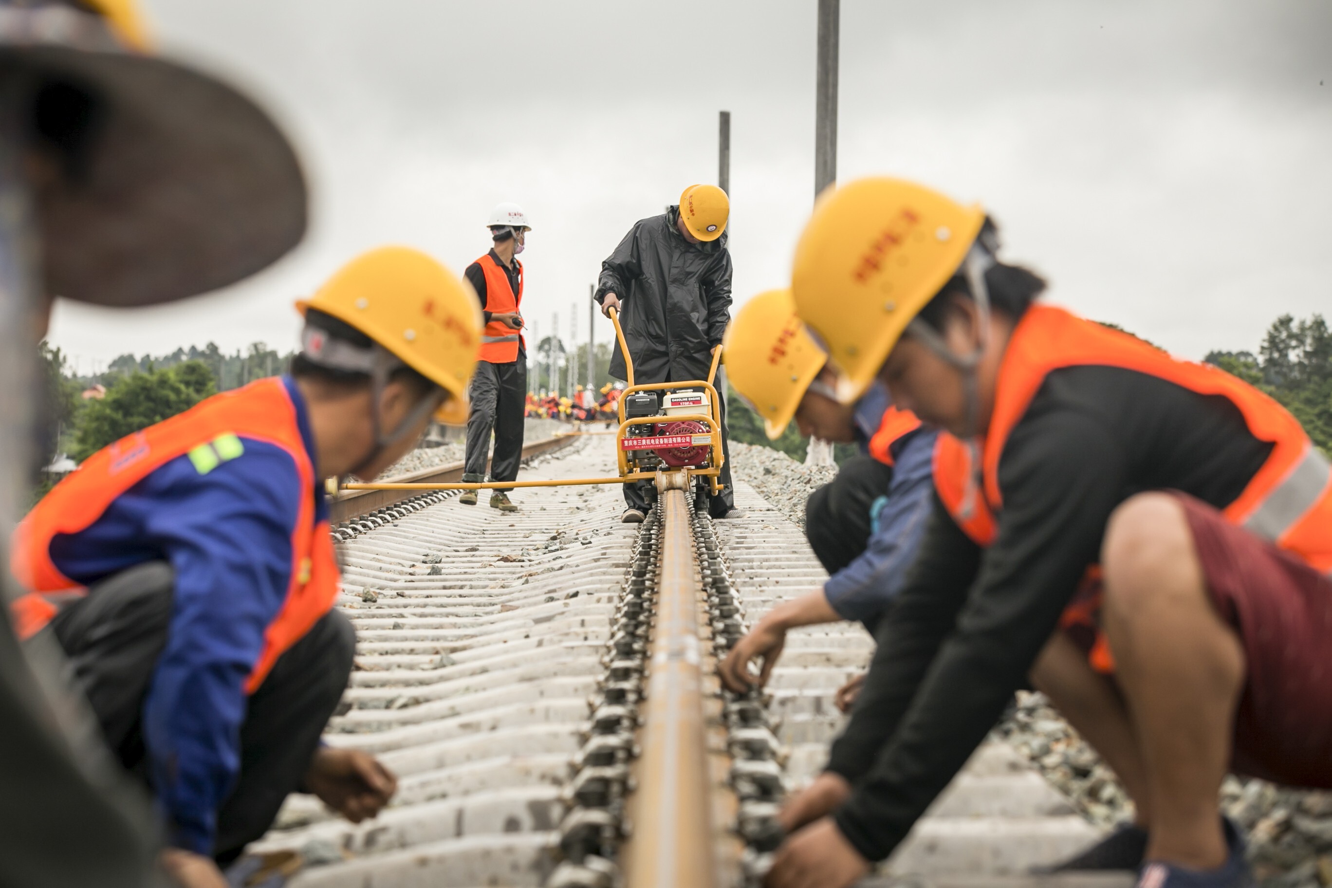 Workers from the China Railway No 2 Engineering Group assemble rails for the China-Laos railway in Vientiane, Laos, on June 18. The China-Laos railway is a project of the Belt and Road Initiative and aims to convert Laos from a landlocked country to a land-linked hub. Photo: Xinhua