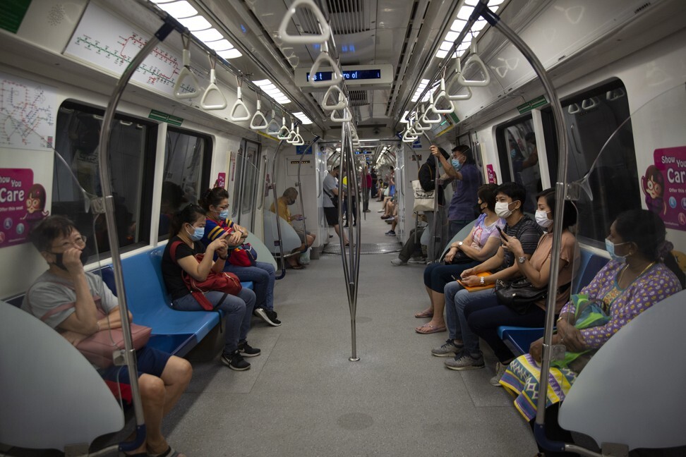 Commuters on a Mass Rapid Transit (MRT) train in Singapore. Photo: EPA