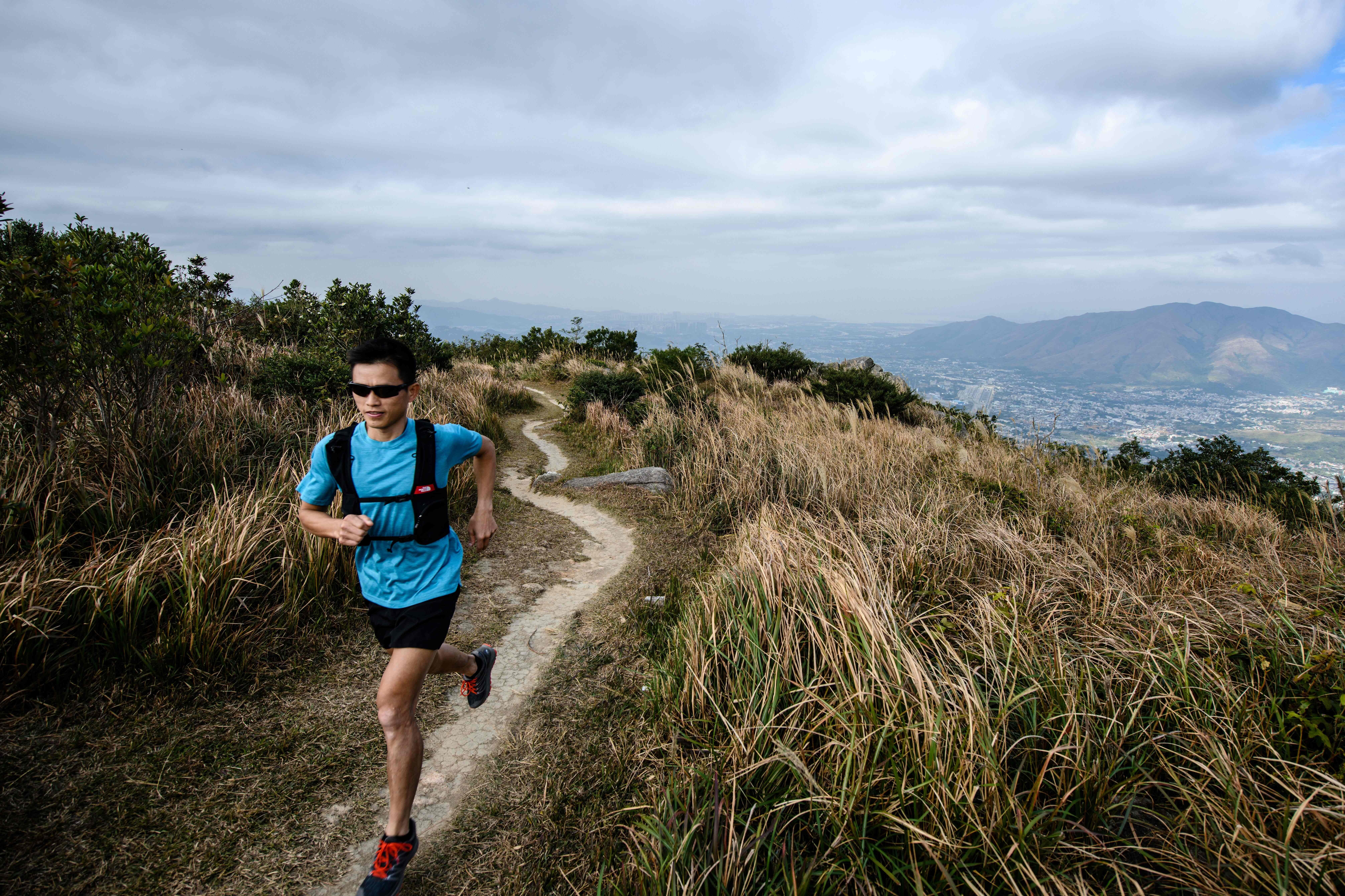 Stone Tsang Siu-keung knows a mask will make running uncomfortable but hopes people will comply. Photo: Agence France-Presse