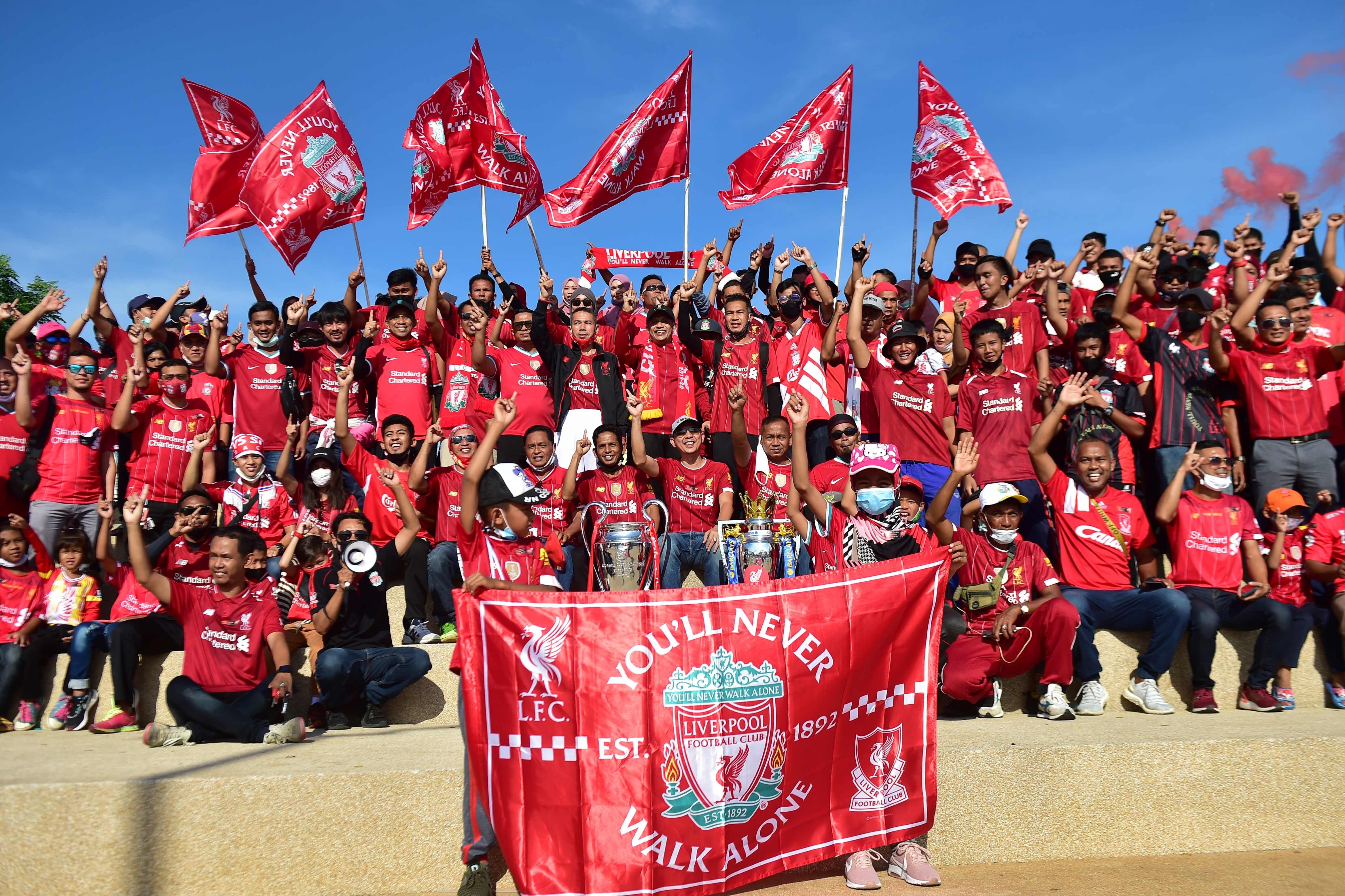 Thai Liverpool supporters celebrate the club’s Premier League title win. Liverpool will return to their region as soon as possible. Photo: AFP