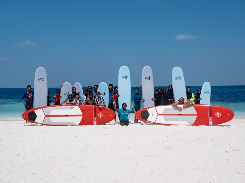 Stand-up success: community outreach can be issue-based education or something more fun, such as paddleboarding. Photo: Soneva