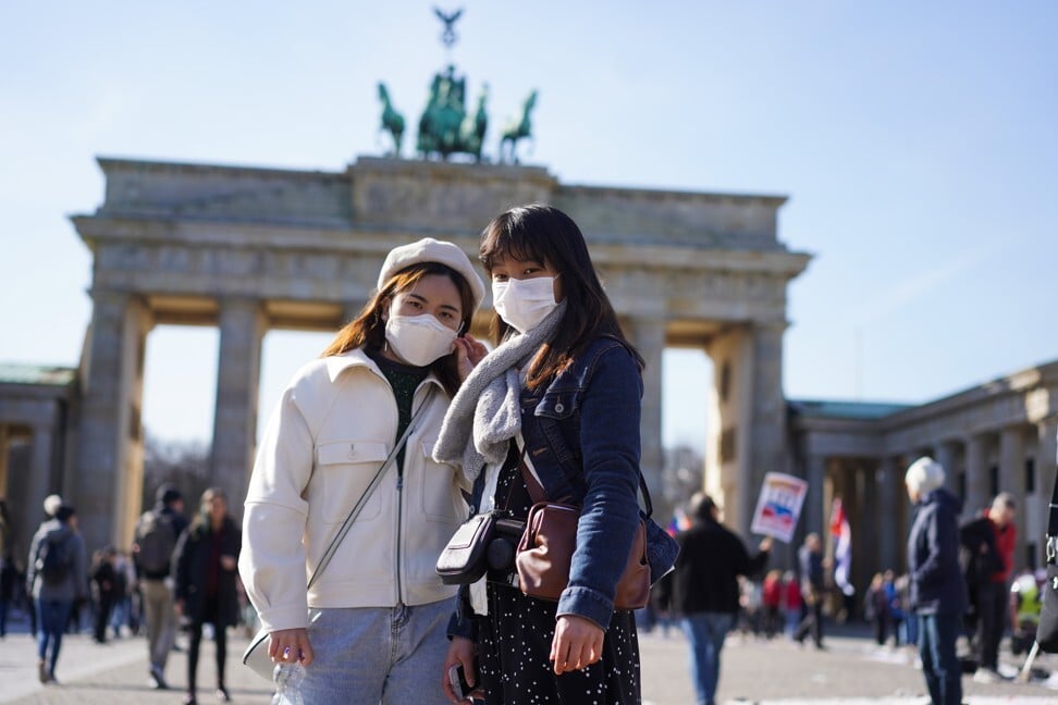 Tourists from Hong Kong stand in front of the Brandenburg Gate in Berlin. Southeast Asians who live in the city say they face racism all the time. Photo: Getty Images