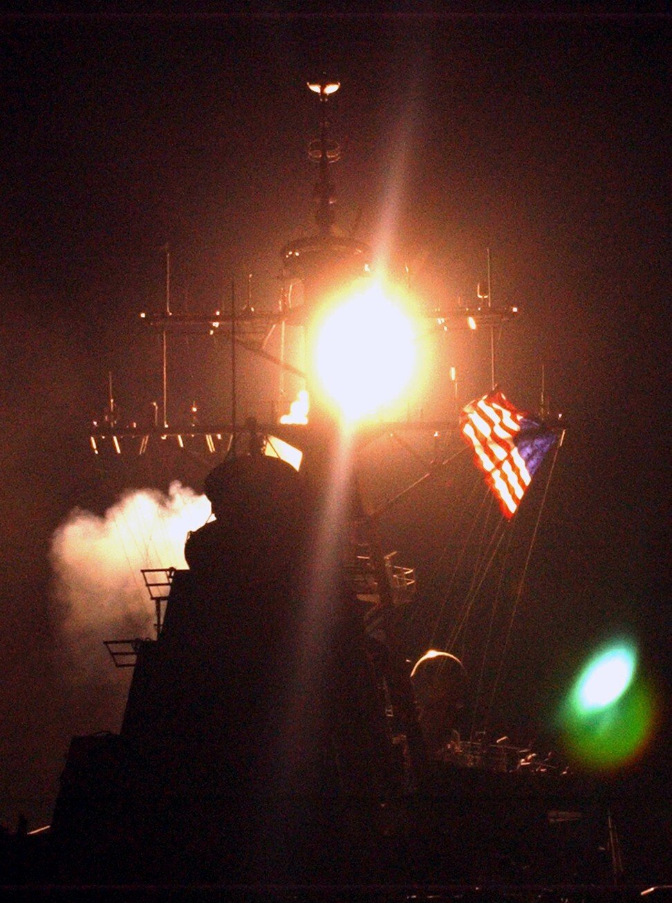 The Arleigh Burke-class guided missile destroyer USS Donald Cook launches three of its Tomahawk missiles at military targets in Iraq in March, 2003. Photo: Reuters