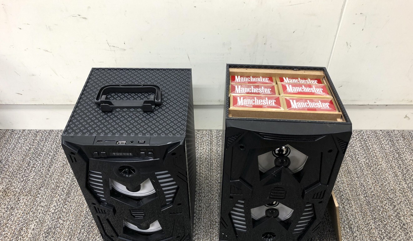 Cartons of cigarettes can be seen packed inside the speakers, which were seized during a bust at a Shenzhen border crossing on Tuesday. Photo: Handout