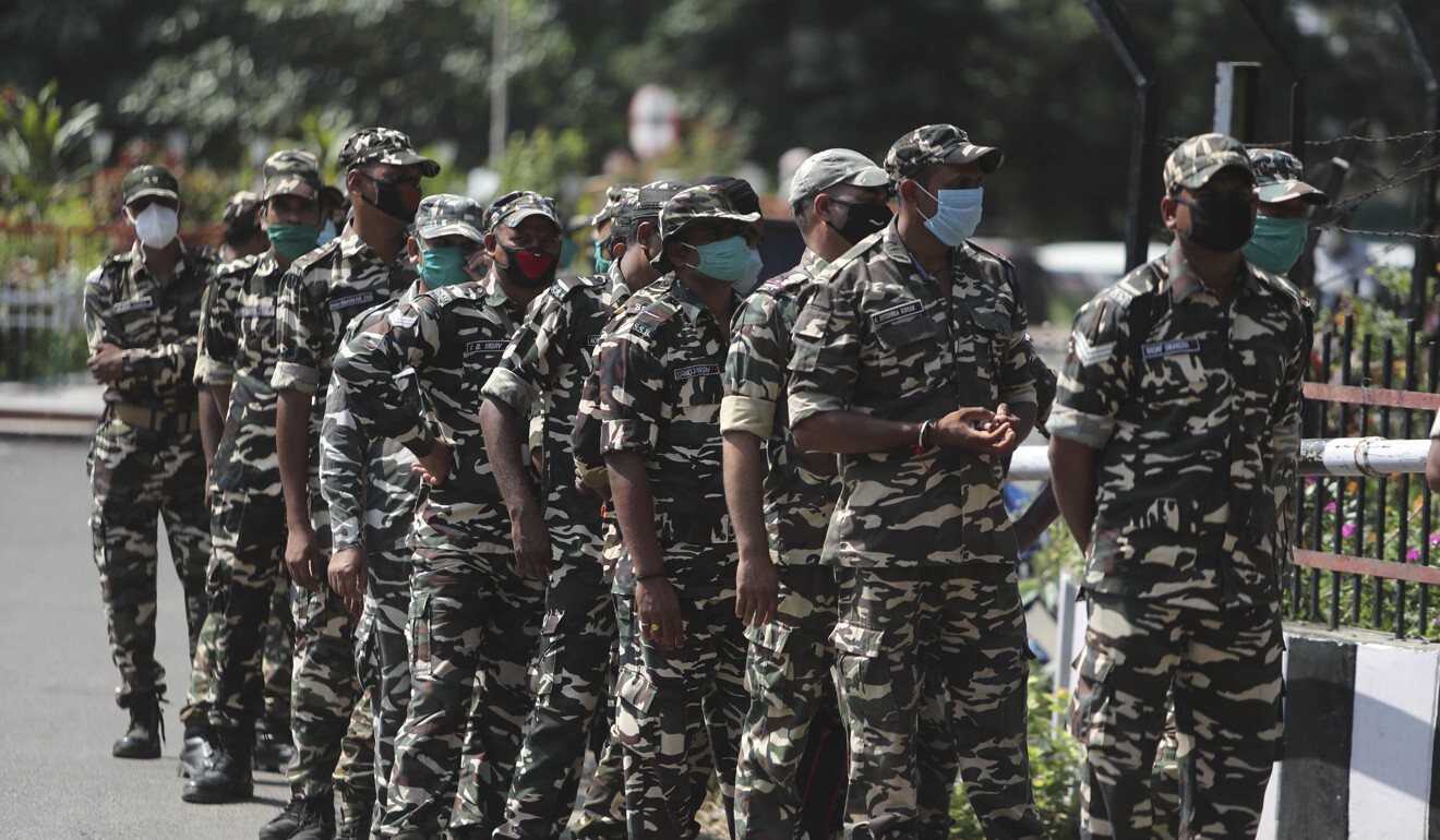 Indian paramilitary soldiers queue to consult doctors at a Covid-19 screening facility in Jammu, India. Photo: AP