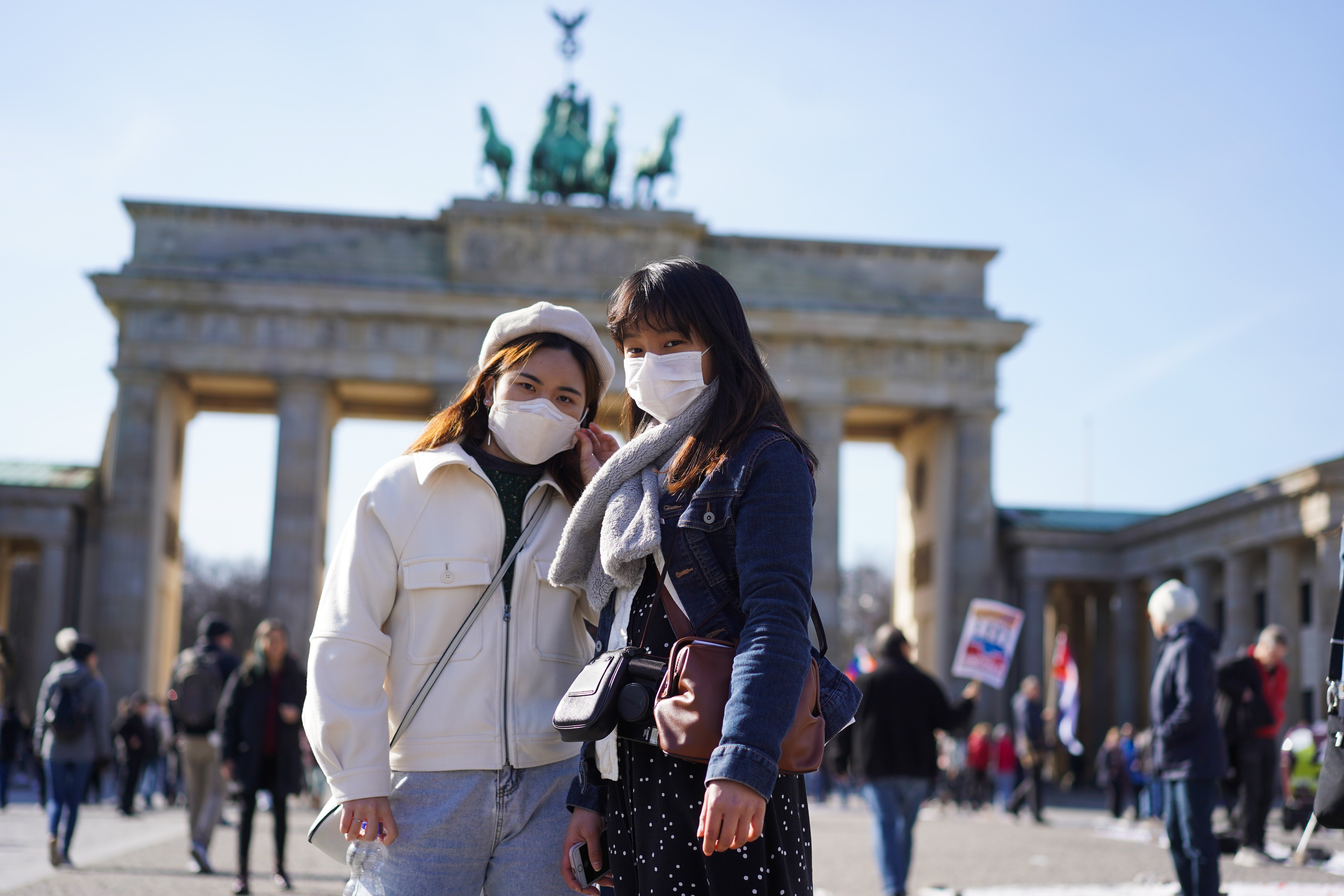 Tourists from Hong Kong in front of the Brandenburg Gate in Berlin, Germany. Photo: Getty Images