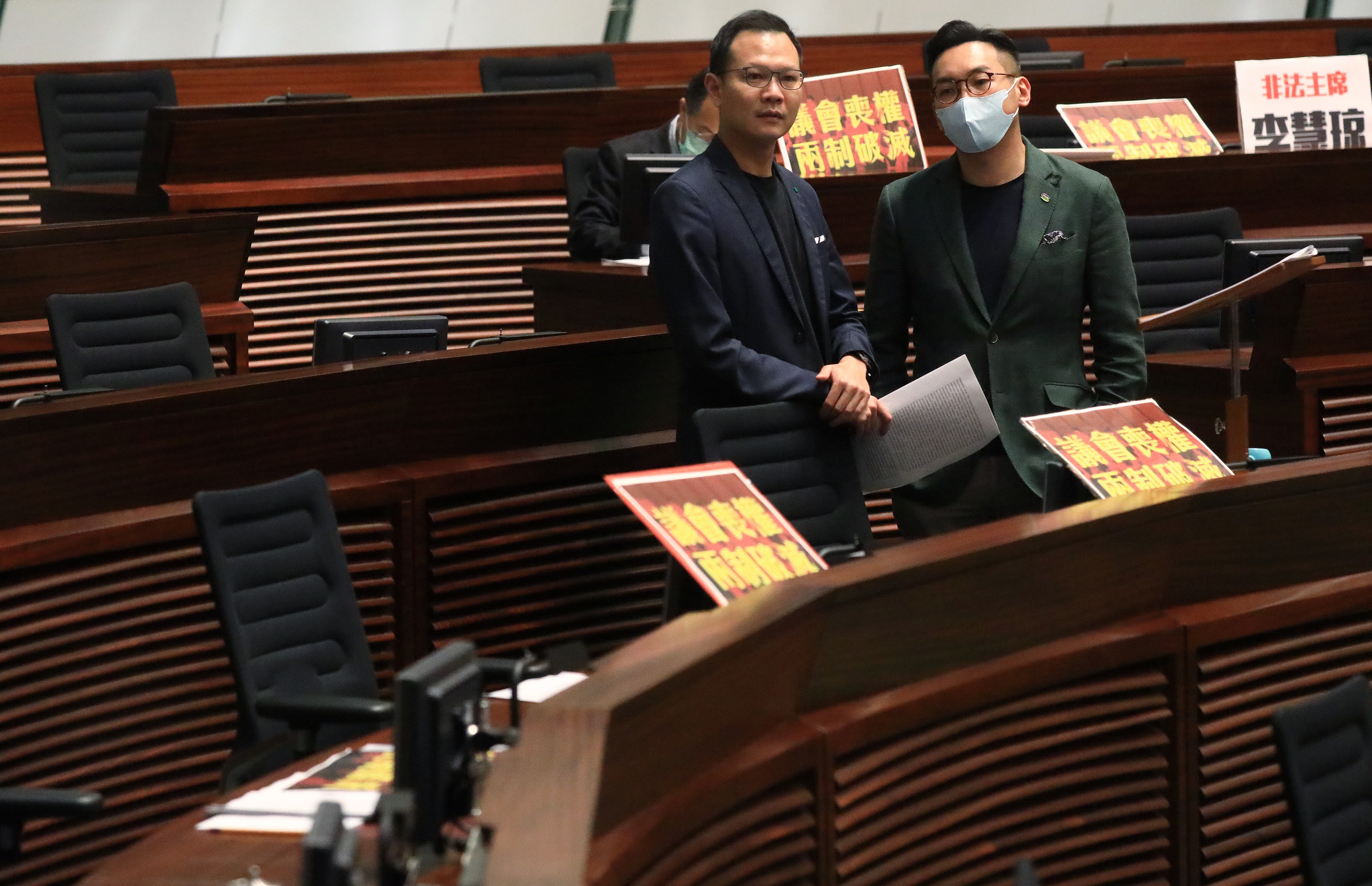 Pan-democrat lawmakers Dennis Kwok (left) and Alvin Yeung have been barred from running in the next Legislative Council polls and may not even be able to retain their seats in a caretaker version of Legco. Photo: May Tse