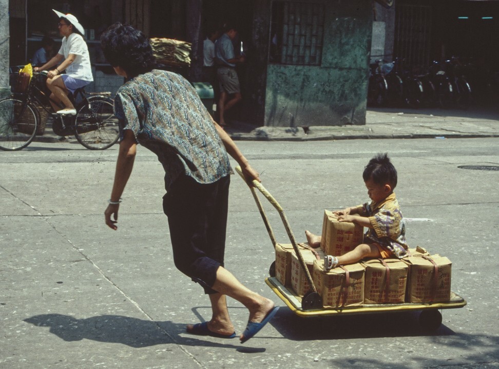 Pulling goods and a child in Guangzhou, 1992. Photo: Bruce Connolly