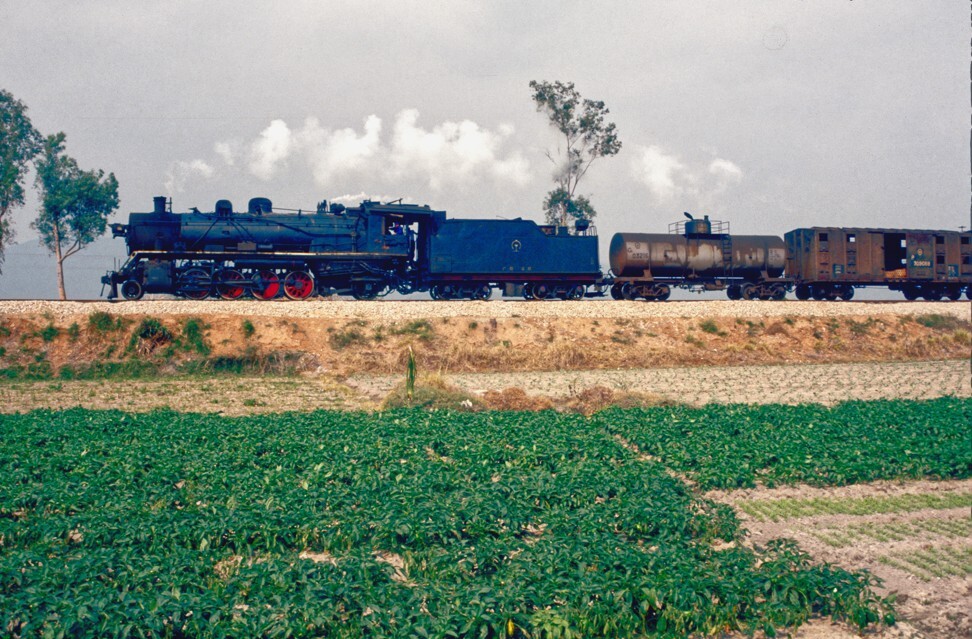 A steam train leaves Sanya, Hainan, in 1993. The railway was built during World War II by prisoners from Japanese internment camps. Photo: Bruce Connolly