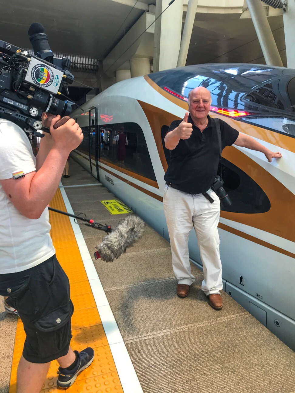Connolly films a segment for BBC Scotland’s Scots in China, at Beijing South Railway Station, in 2018. Photo: Bruce Connolly
