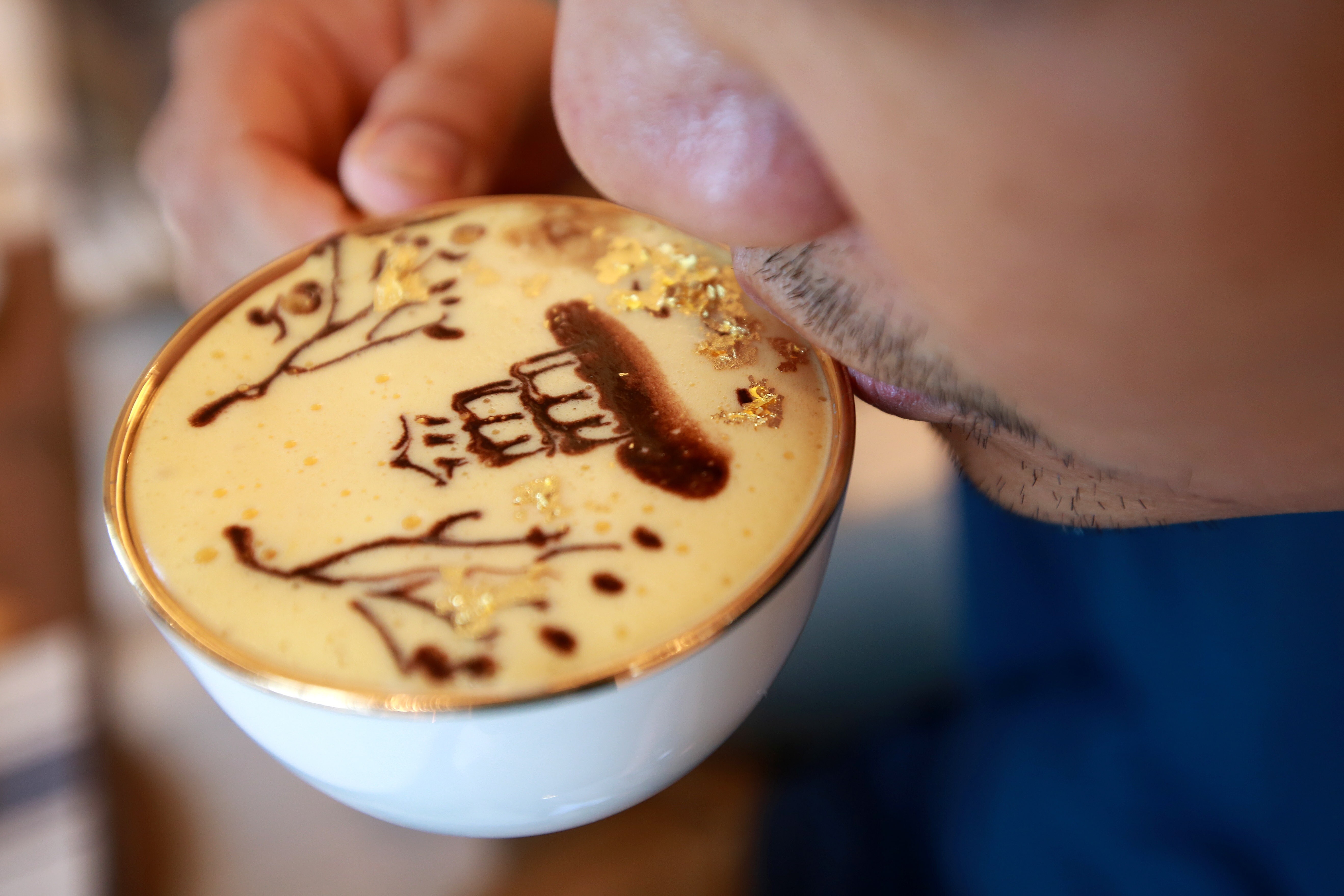 A man in Vietnam sips at a cup of so-called “Golden Egg Coffee” at the Dolce Hanoi Golden Lake hotel in Hanoi, billed as Southeast Asia’s most luxurious hotel, on July 24. Asia’s growing middle class is tomorrow’s savvy consumer. Photo: EPA-EFE