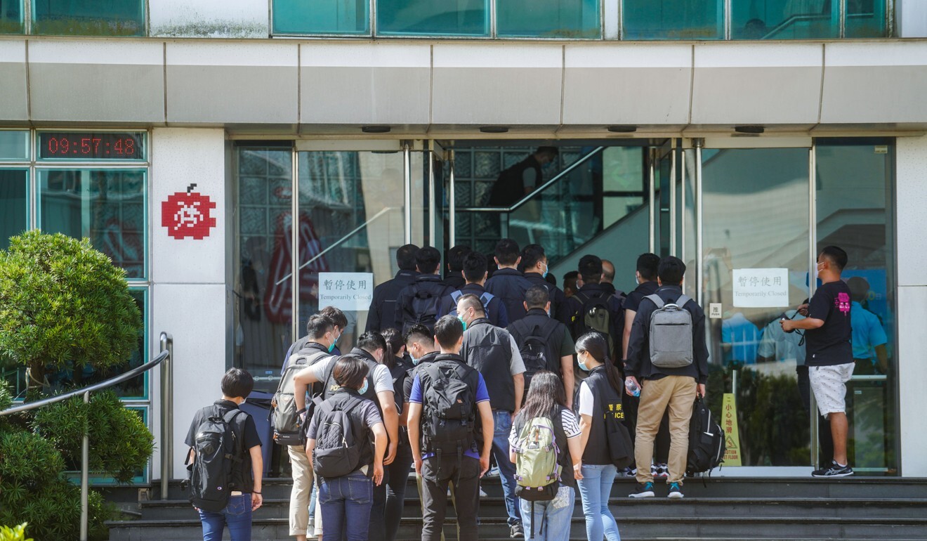 Police officers arrive at the Next Digital Limited building in Tseung Kwan O. Photo: Sam Tsang