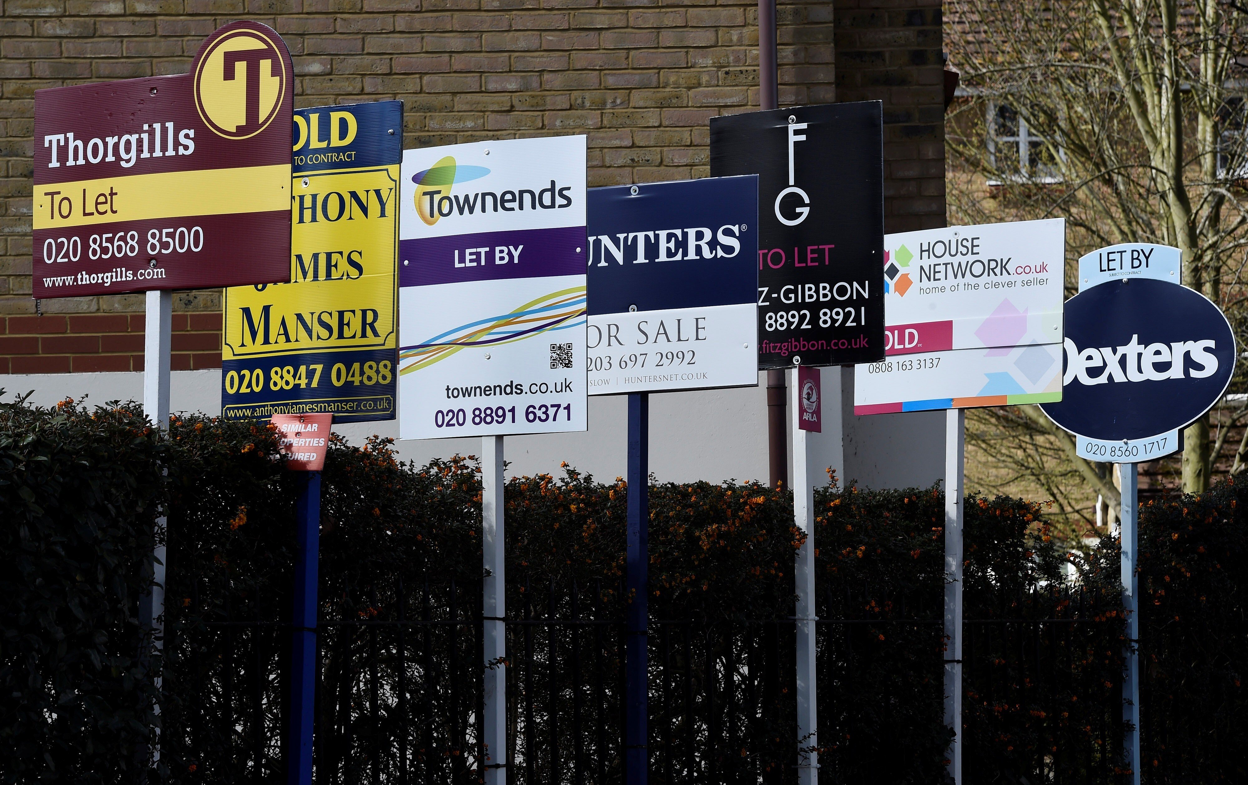 Property agents’ sales and to let signs are seen in London. London is epcted to see a revival in overseas buying interest after the pandemic ends. Photo: Reuters