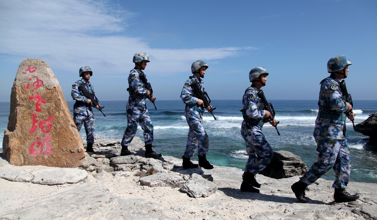 People’s Liberation Army Navy soldiers patrol Woody Island, in the Paracels Archipelago. Photo: Reuters