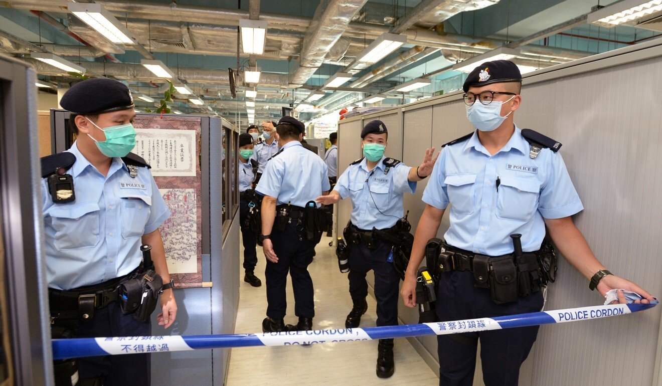 Hong Kong police cordon off an office area of the Apple Daily newspaper after arresting its founder Jimmy Lai on suspicion of foreign collusion. Photo: Handout