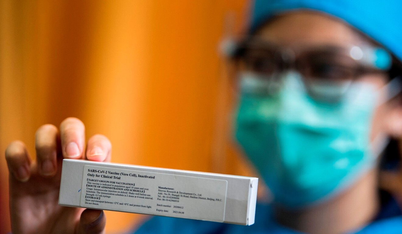 A health care worker shows a carton of vaccine ahead of clinical trials at Padjadjaran University’s faculty of medicine earlier this month. Photo: Reuters