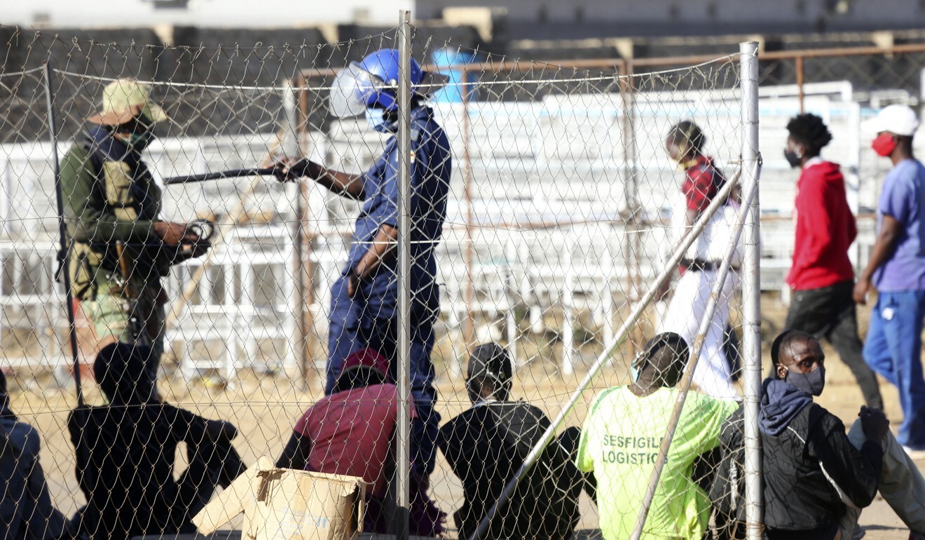 Zimbabwean police and army round up people at a checkpoint in Harare. Photo: AFP
