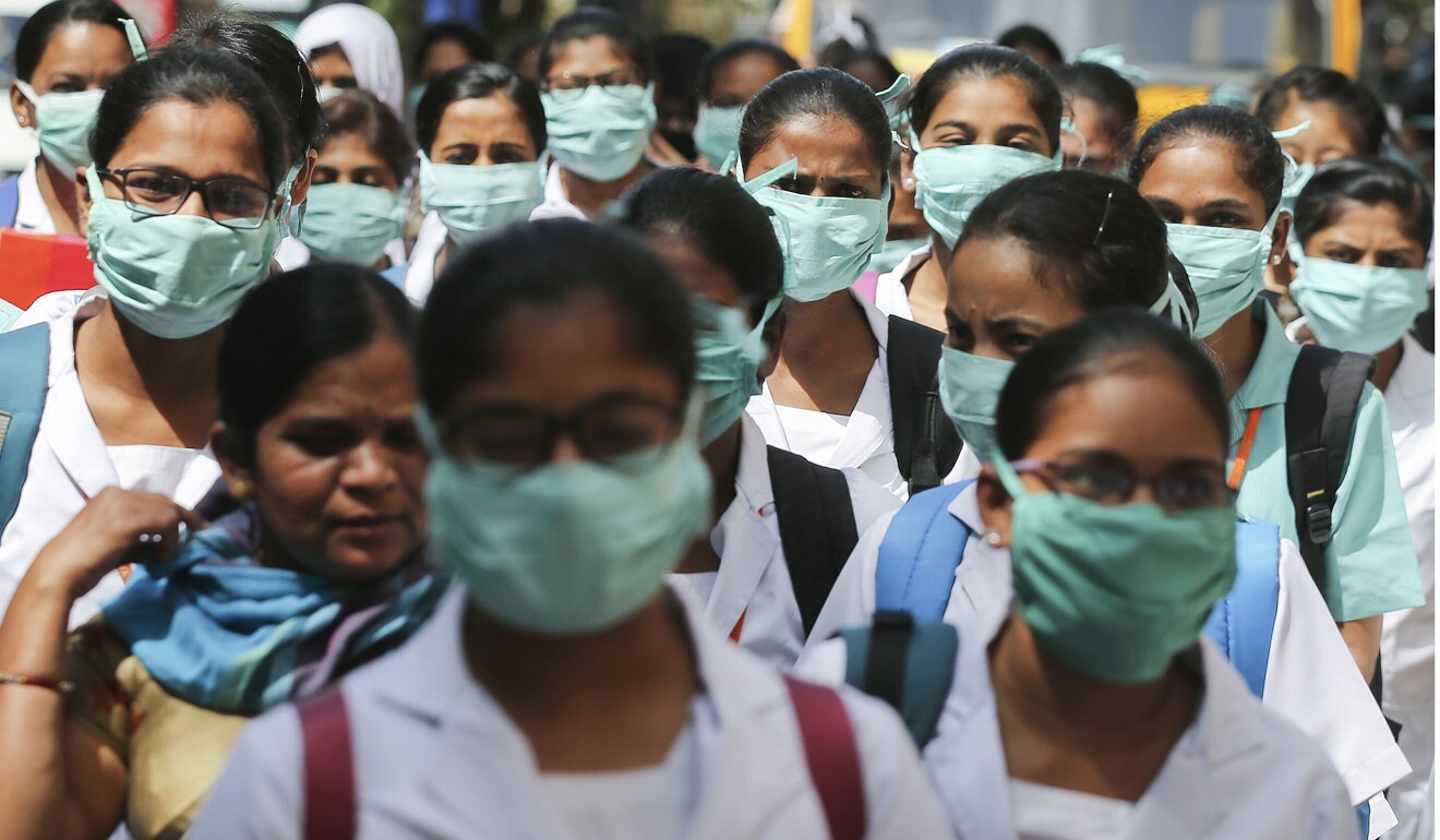 Indian students are seen wearing masks in Hyderabad, India. Photo: AP Indian students are seen wearing masks in Hyderabad, India. Photo: AP