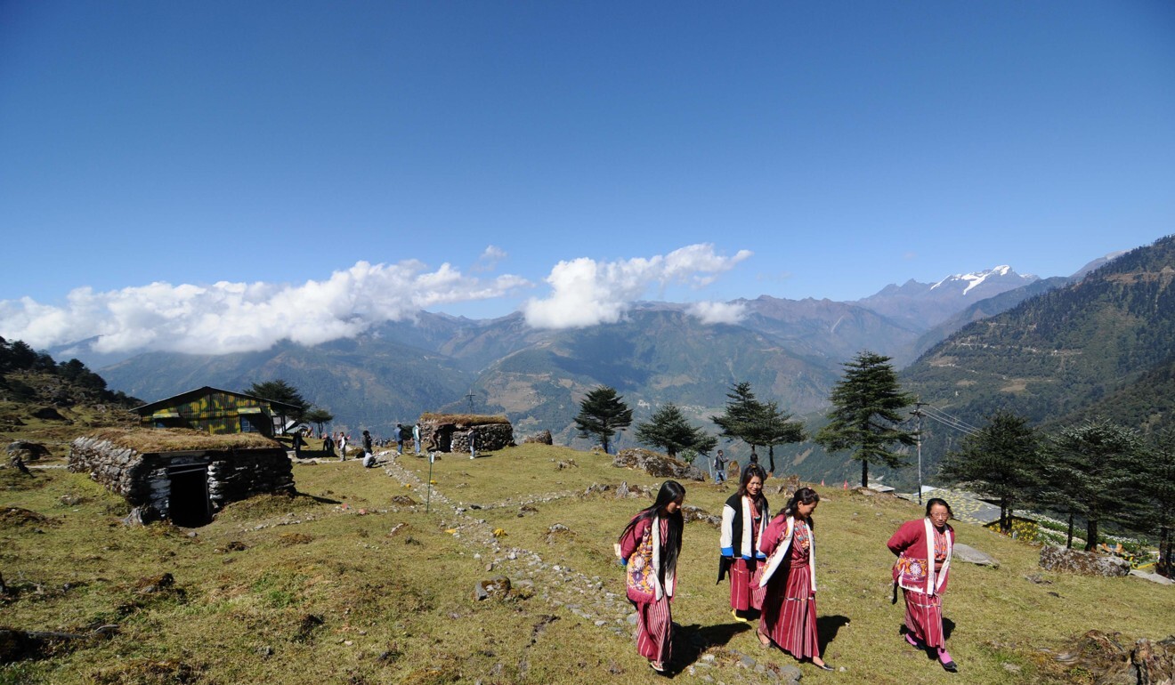 Tribal women visit bunkers from the Indo-China war at a memorial in Jaswant Garh in Arunachal Pradesh near the border. Photo: AFP