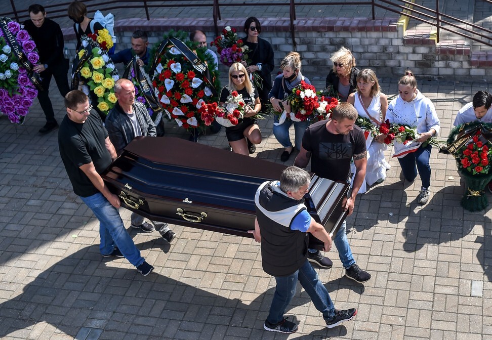 Men carry a coffin with the body of Alexander Taraikovsky, a 34-year-old protester who died on August 10. Photo: AFP