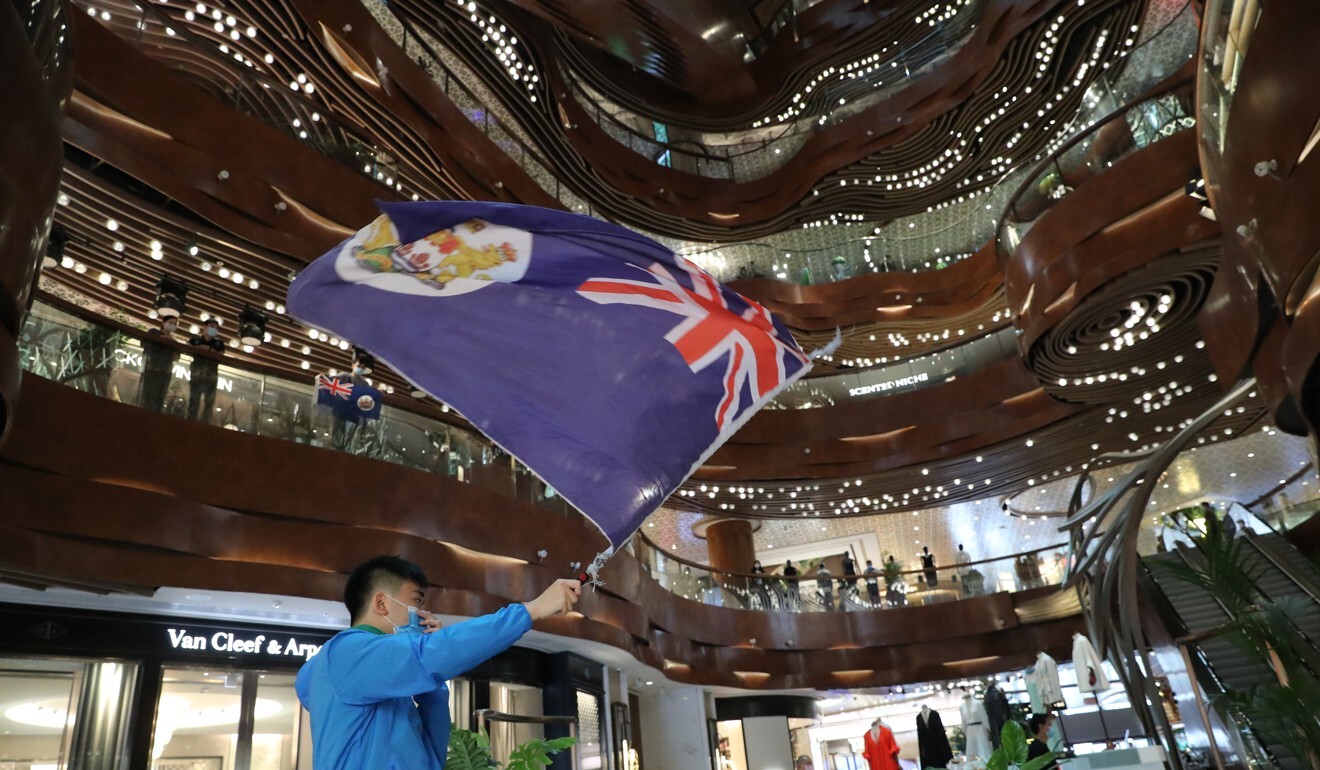 The British Hong Kong colonial flag makes an appearance at a protest in Tsim Sha Tsui. Photo: Edmond So