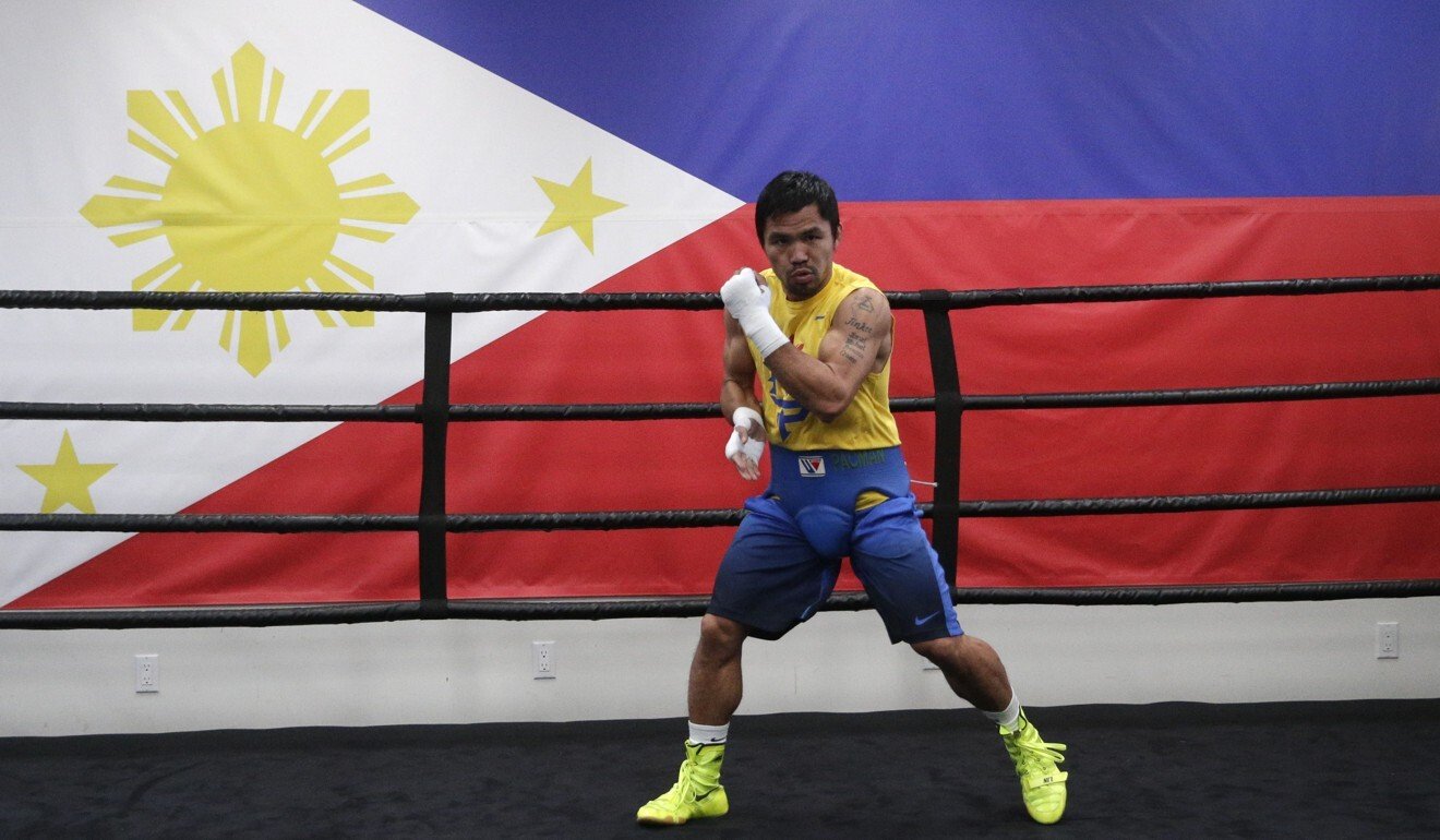 Boxing legend Manny Pacquiao trains in front of a Philippines flag at Wild Card Boxing Club, Los Angeles in 2015. Photo: AP