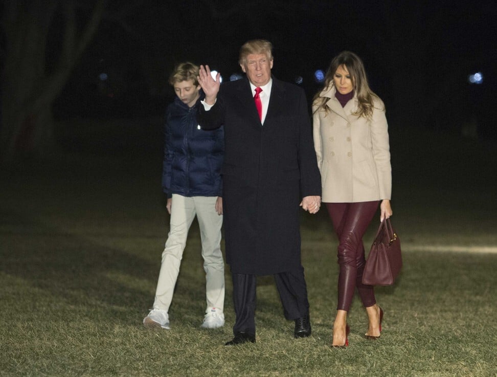President Donald Trump, first lady Melania Trump and son Barron on New Year’s Day 2018. Photo: Getty Images
