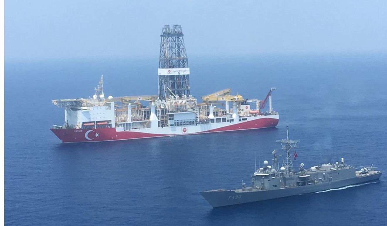 A Turkish Navy warship patrols next to Turkey's drilling ship ‘Fatih’ in 2019. File photo: AFP