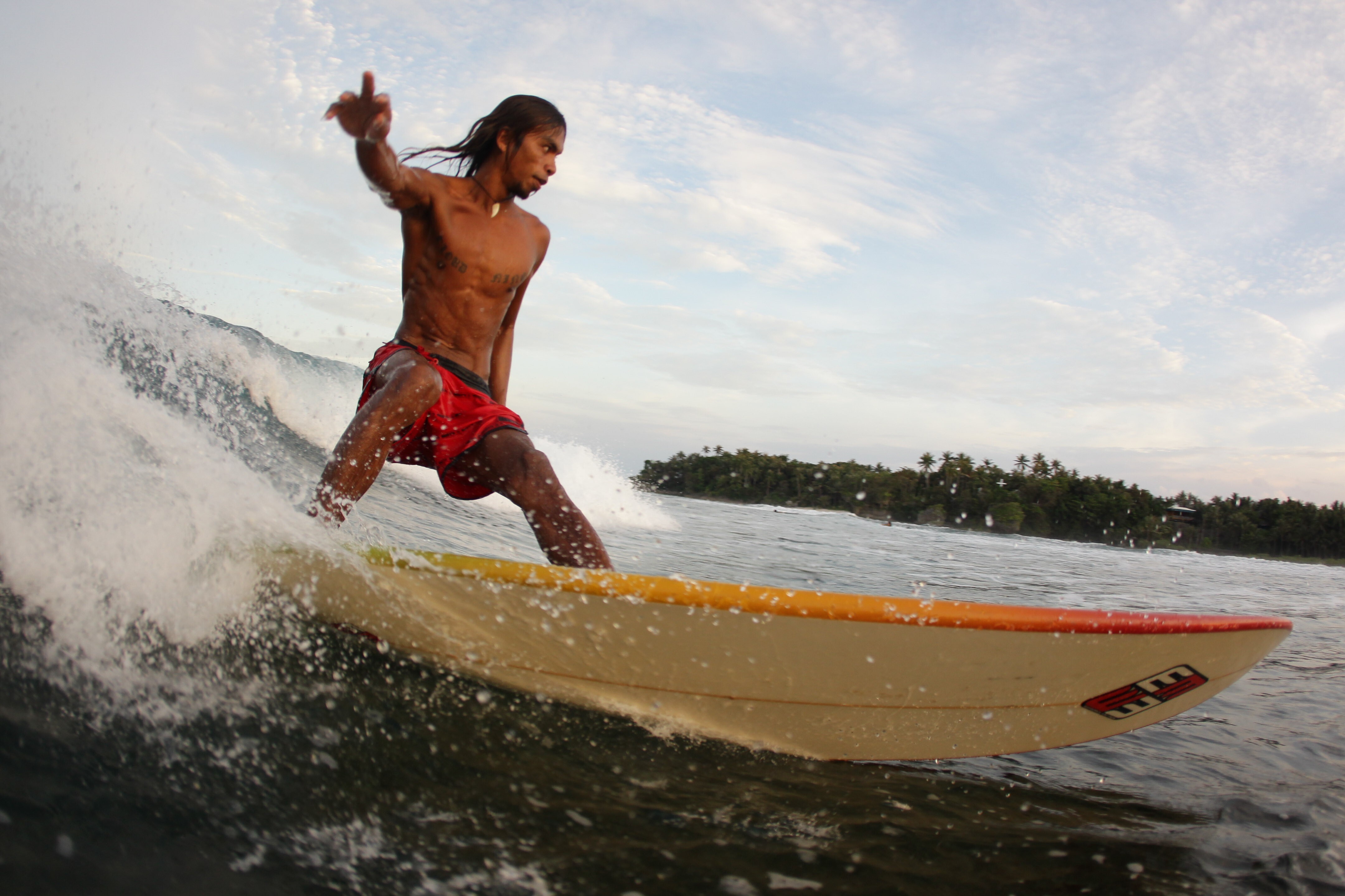 A surfer rides a wave at Cloud 9 in Siargao. Photo: Getty Images