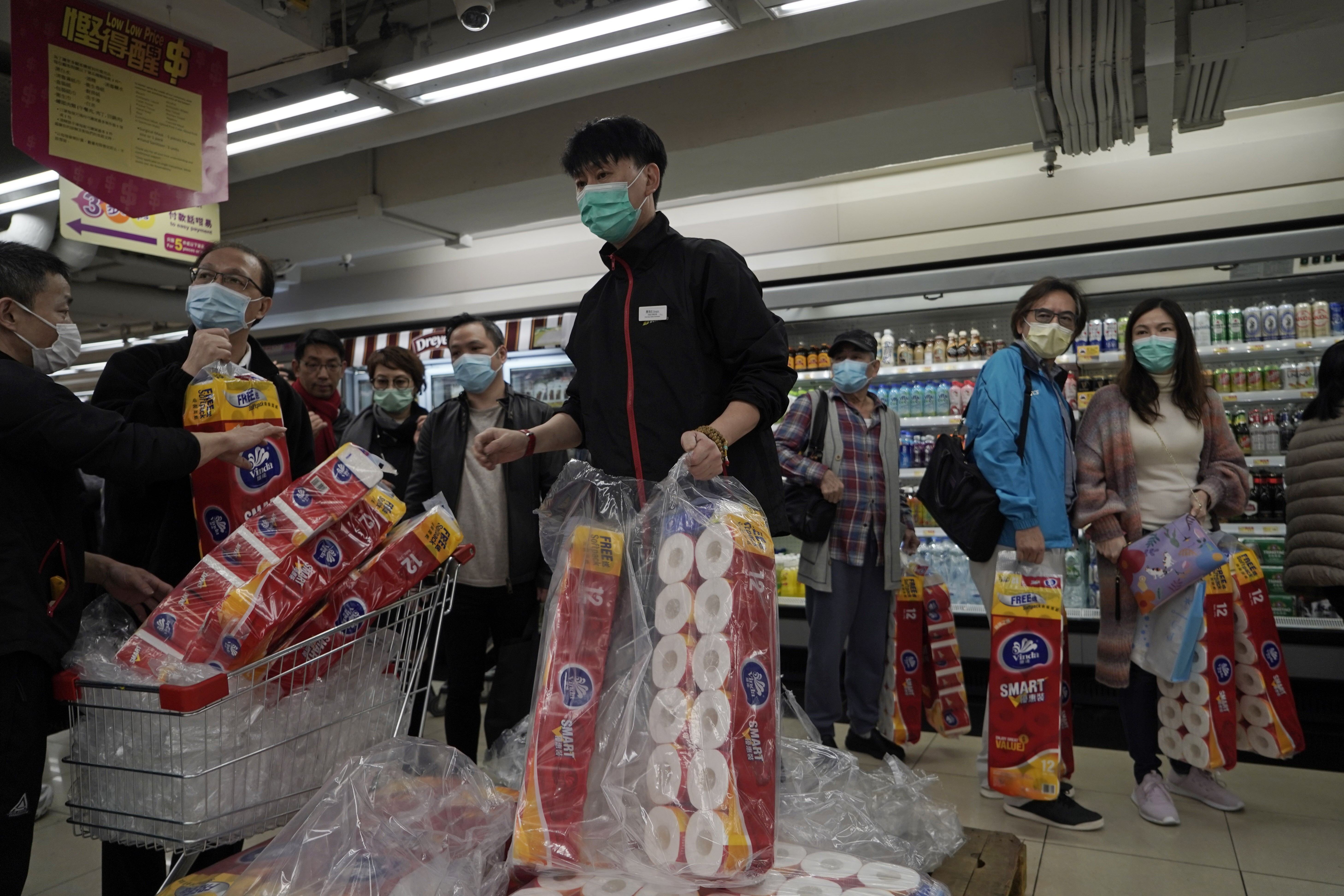 Customers queue to buy supplies of toilet paper in Hong Kong on February 14, as mainland Chinese reports of surging Covid-19 cases left supermarket shelves emptied in the city. Photo: AP