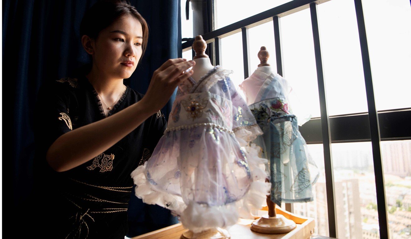 Wu puts together Hanfu gowns for cats at her house in Changsha. Photo: Noel Celis/AFP