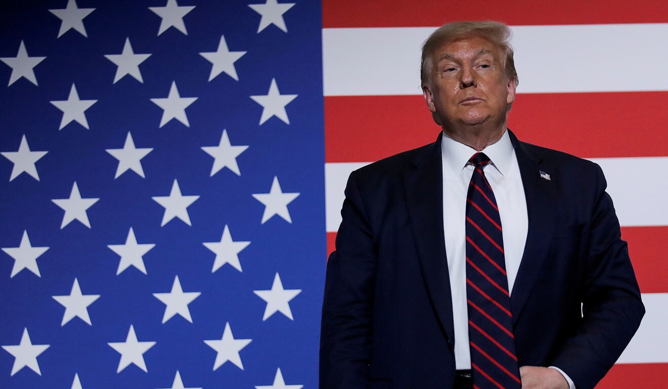 US President Donald Trump stands in front of an American flag as he participates in a round table discussion on donating plasma during a visit to the American Red Cross National Headquarters in Washington in July. Photo: Reuters