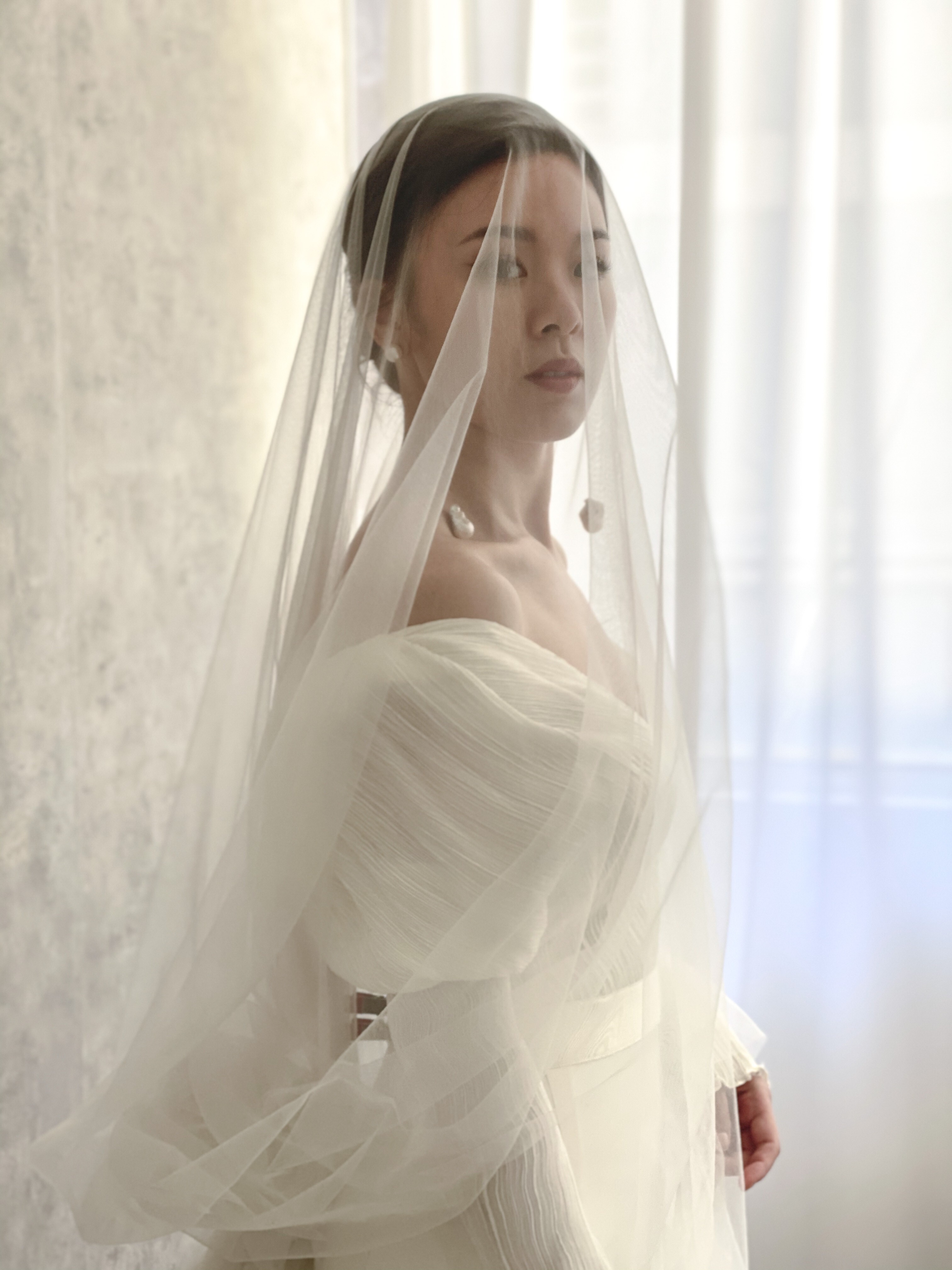 A bride styled by Jackie Au for a wedding shoot.