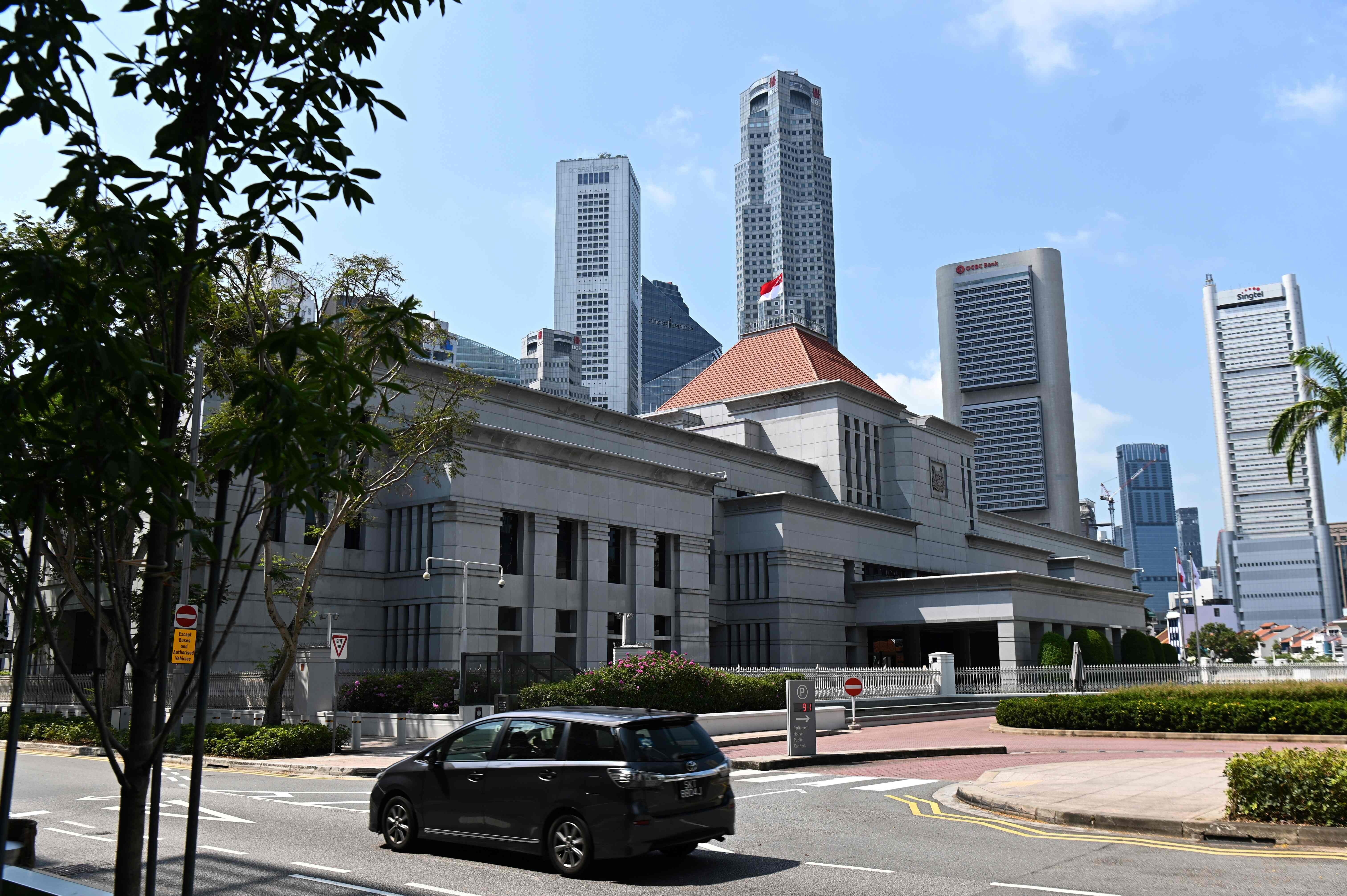 The national flag of Singapore flies on the roof of Parliament House in this file photo. Photo: AFP