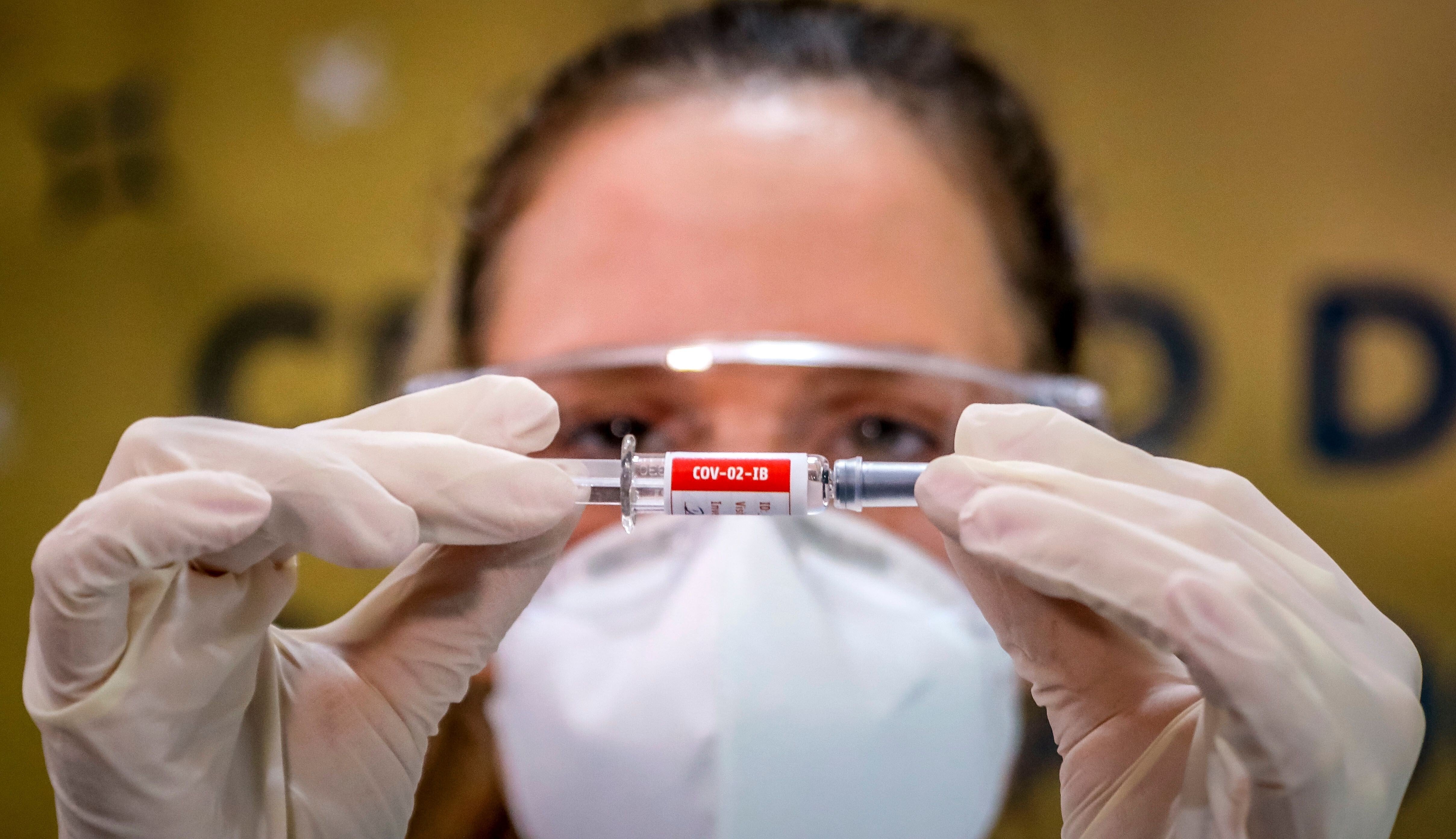 Traders remain focused on the hunt for treatments and vaccines for the coronavirus. Here, a nurse shows a Covid-19 vaccine produced by Chinese company Sinovac Biotech at the Sao Lucas Hospital in Porto Alegre, southern Brazil on August 8, 2020. The vaccine trial is being carried out in Brazil in partnership with Brazilian Research Institute Butanta. Photo: Agence France-Presse