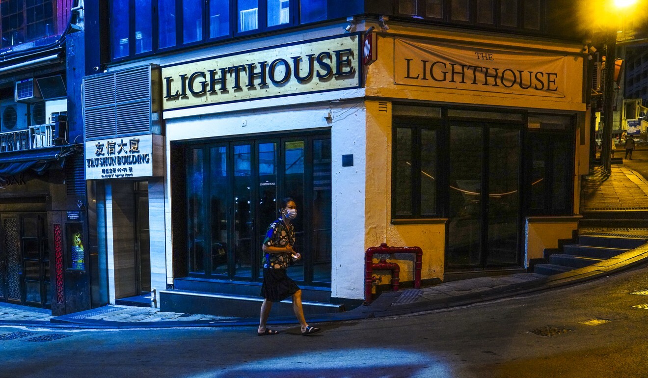 A pedestrian walks past a quiet street in normally bustling Lan Kwai Fong. Photo: Sam Tsang